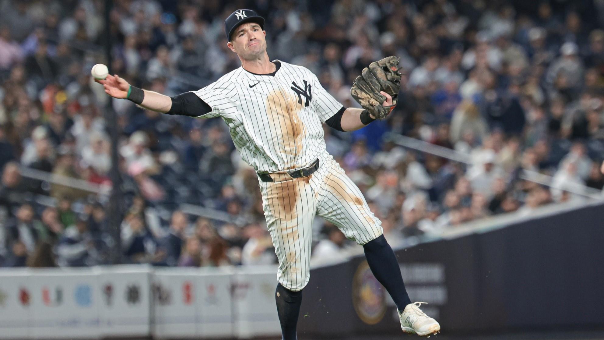 Apr 9, 2024; Bronx, New York, USA; New York Yankees third baseman Jon Berti (19) throws the ball to first base for an out during the fourth inning against the New York Yankees at Yankee Stadium. / Vincent Carchietta-USA TODAY Sports