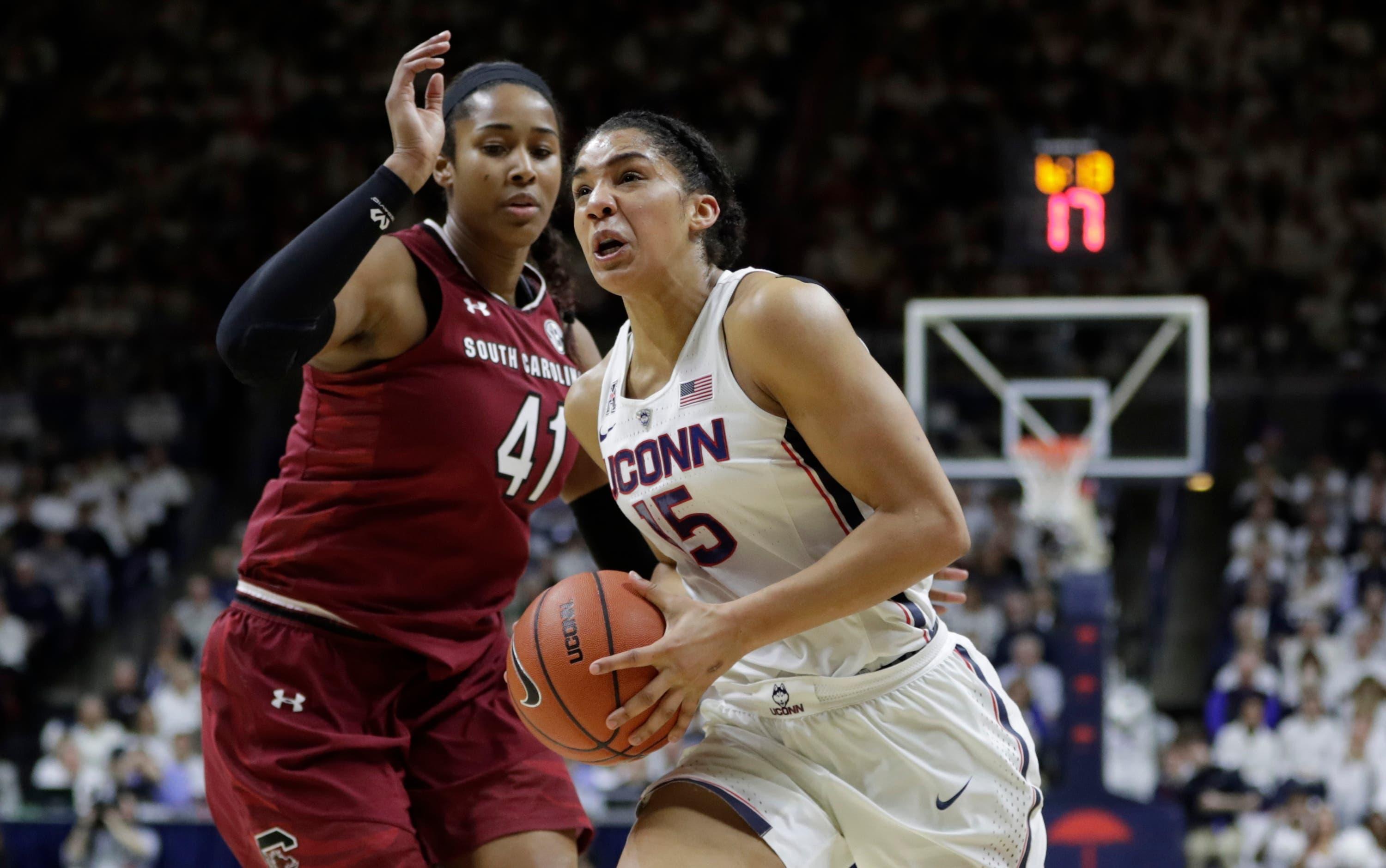 Connecticut Huskies guard Gabby Williams drives the ball against South Carolina Gamecocks center Alaina Coates in the first half at Harry A. Gampel Pavilion. / David Butler II/USA Today Sports Images