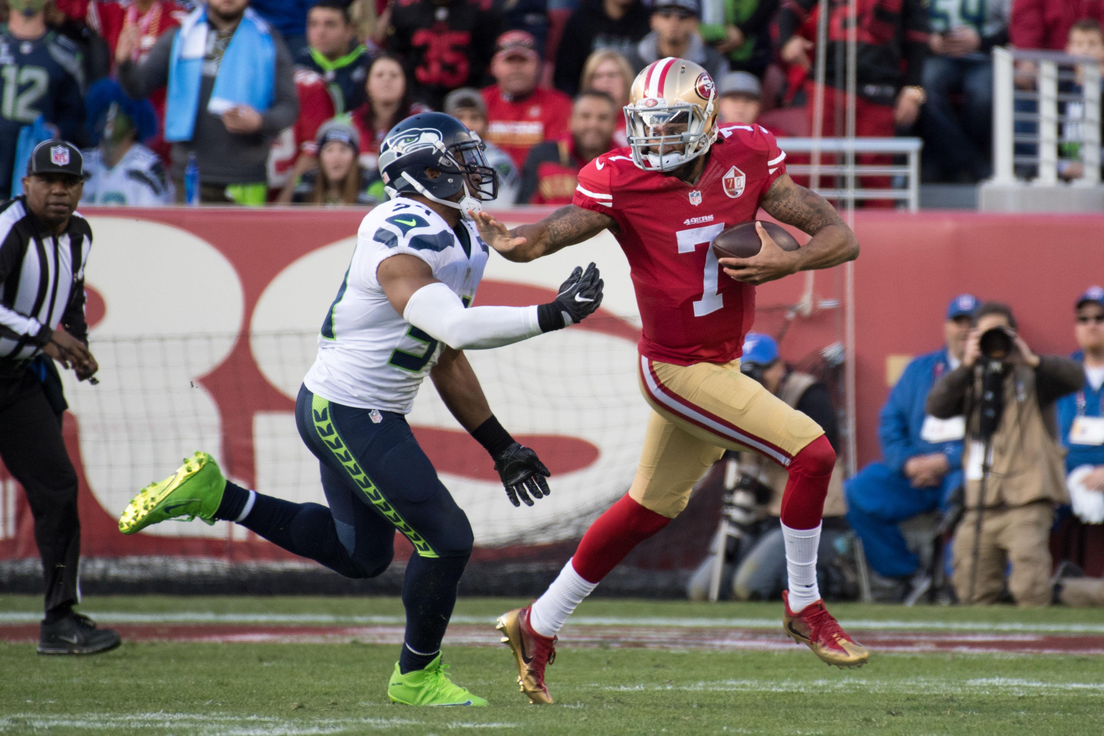 January 1, 2017; Santa Clara, CA, USA; San Francisco 49ers quarterback Colin Kaepernick (7) runs against Seattle Seahawks middle linebacker Bobby Wagner (54) during the second quarter at Levi's Stadium. The Seahawks defeated the 49ers 25-23. Mandatory Credit: Kyle Terada-USA TODAY Sports