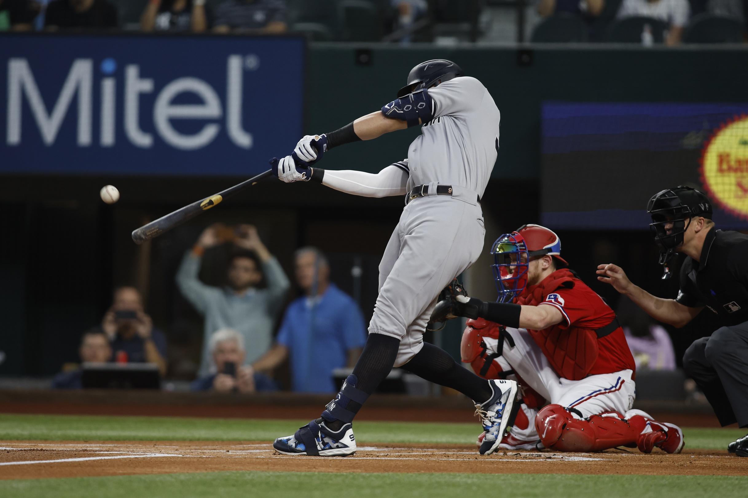 New York Yankees right fielder Aaron Judge (99) hits his 62nd home run to break the American League home run record in the first inning against the Texas Rangers at Globe Life Field. / Tim Heitman-USA TODAY Sports