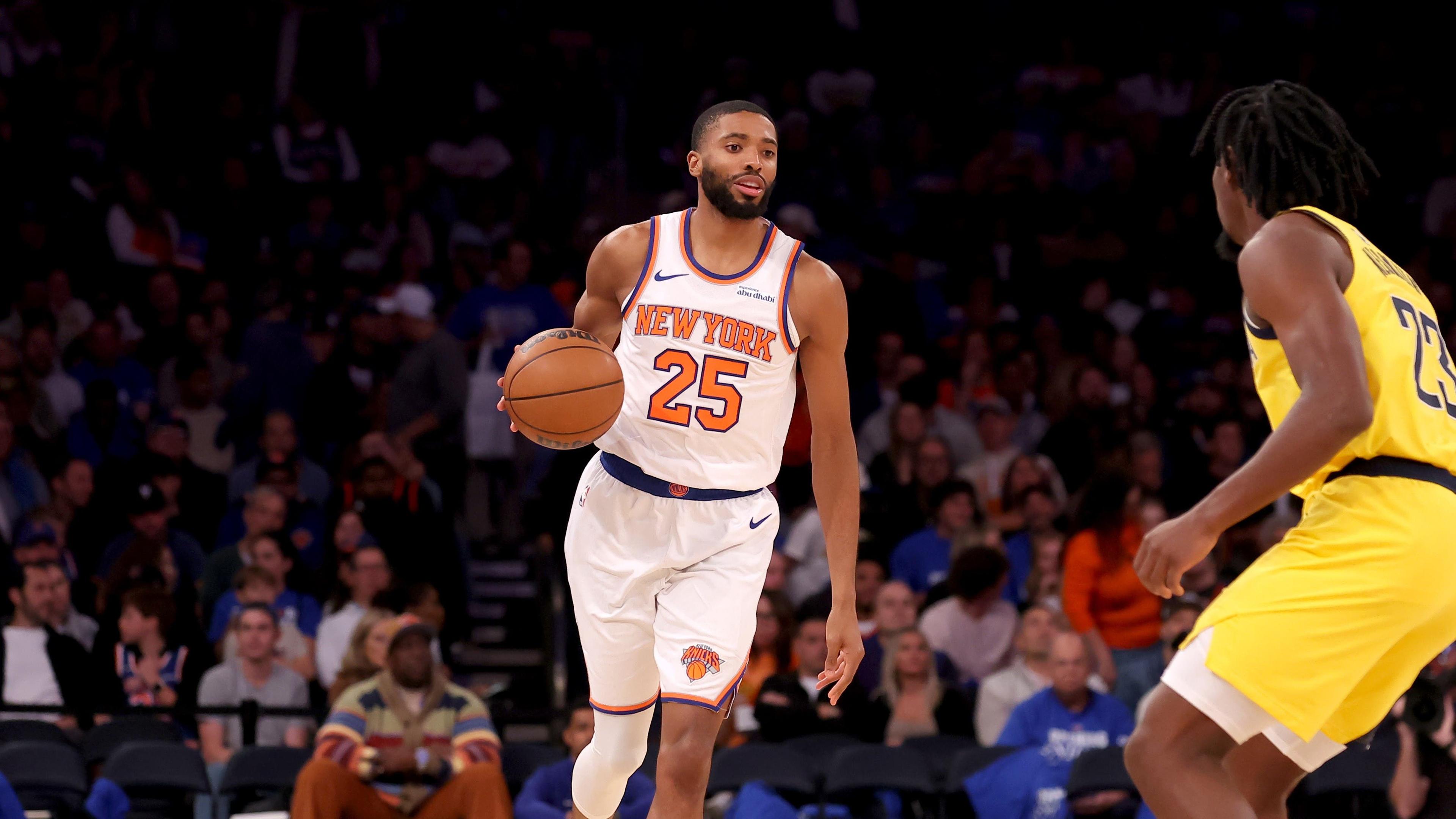 Oct 25, 2024; New York, New York, USA; New York Knicks forward Mikal Bridges (25) brings the ball up court against Indiana Pacers forward Aaron Nesmith (23) during the third quarter at Madison Square Garden. Mandatory Credit: Brad Penner-Imagn Images