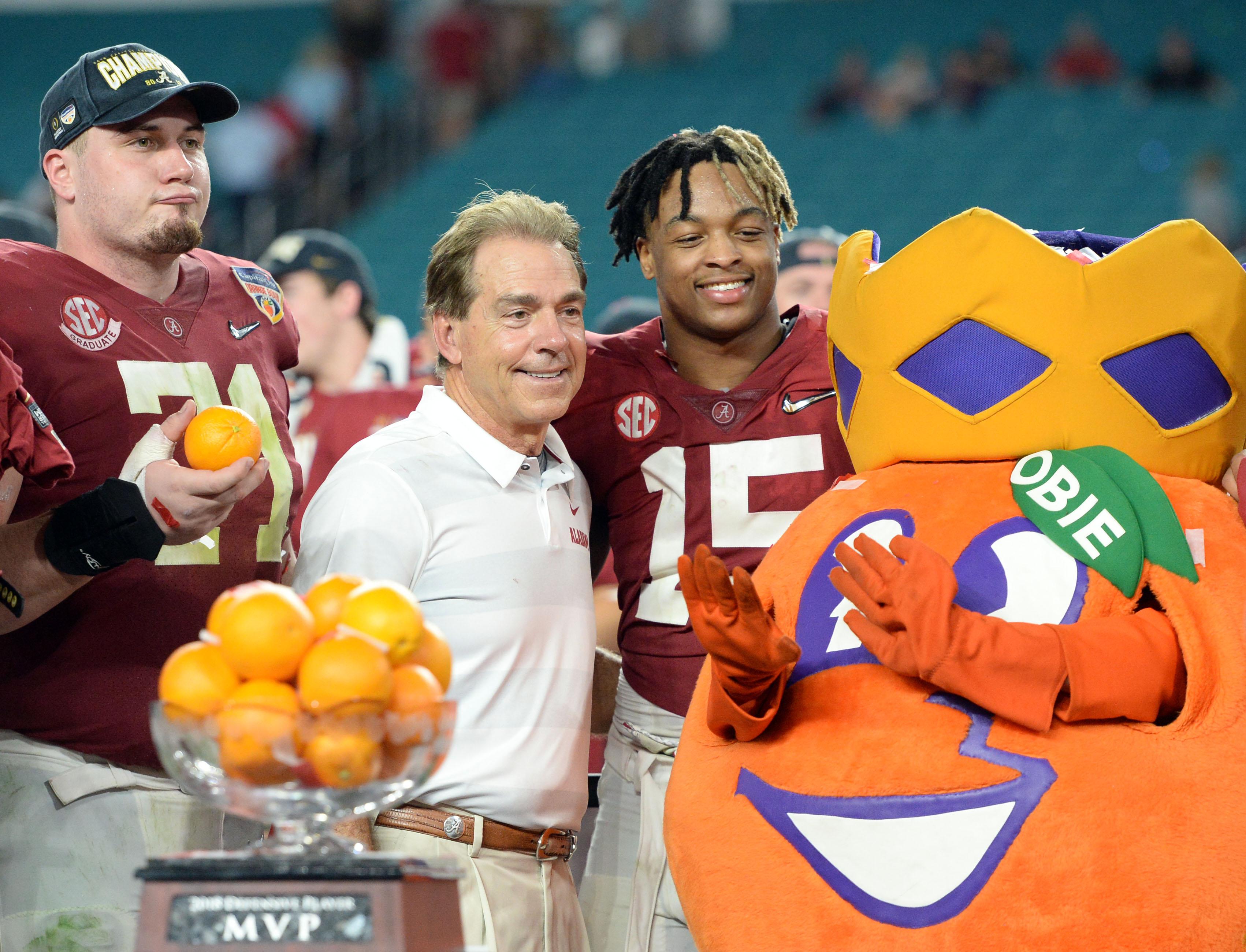 Dec 29, 2018; Miami Gardens, FL, USA; Alabama Crimson Tide head coach Nick Saban and defensive back Xavier McKinney (15) celebrate after defeating the Oklahoma Sooners in the 2018 Orange Bowl college football playoff semifinal game at Hard Rock Stadium. Mandatory Credit: John David Mercer-USA TODAY Sports