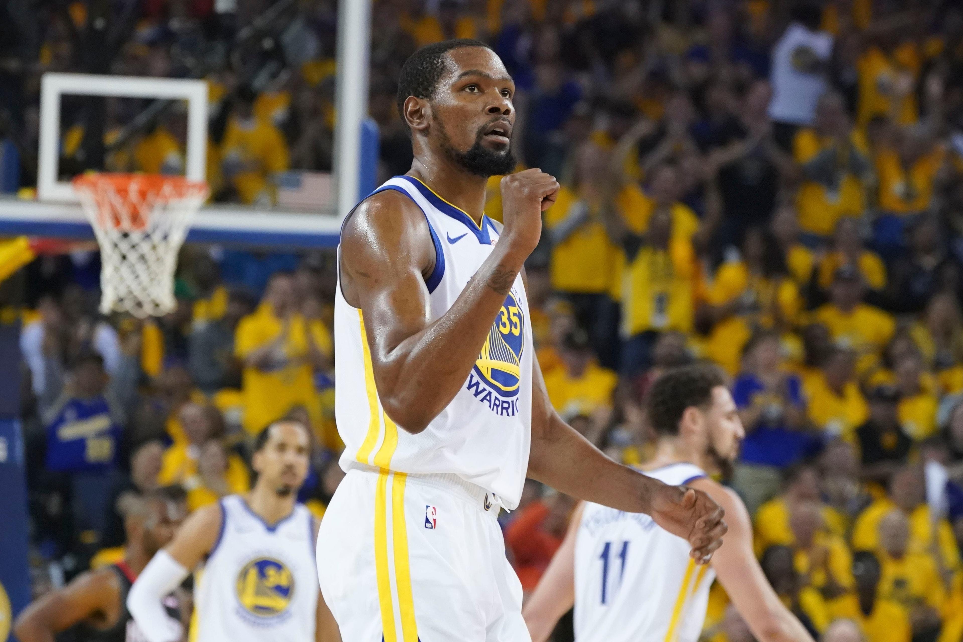 Golden State Warriors forward Kevin Durant celebrates against the Houston Rockets during the second quarter in Game 2 of the second round of the 2019 NBA Playoffs at Oracle Arena. / Kyle Terada/USA TODAY Sports