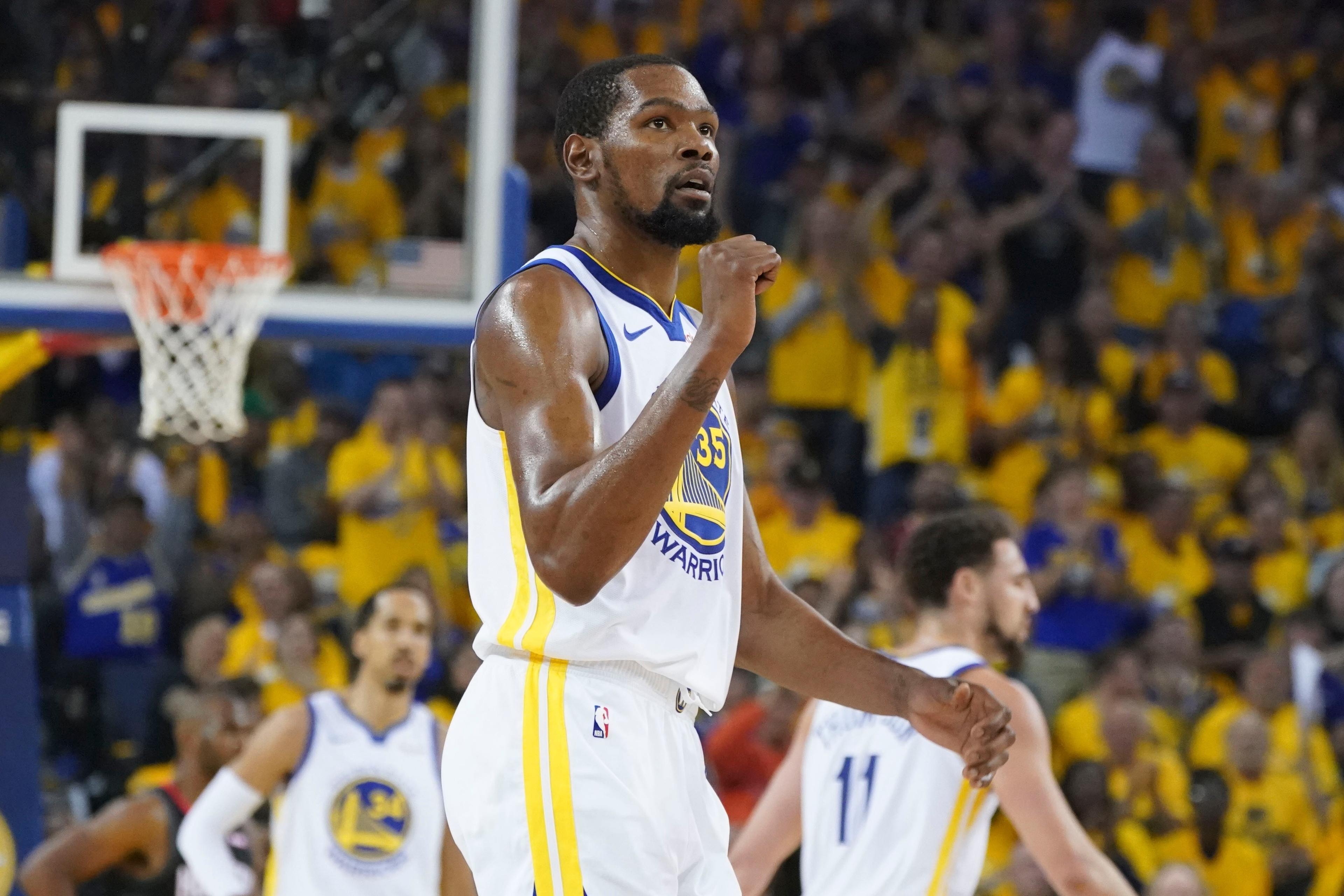 Golden State Warriors forward Kevin Durant celebrates against the Houston Rockets during the second quarter in Game 2 of the second round of the 2019 NBA Playoffs at Oracle Arena.