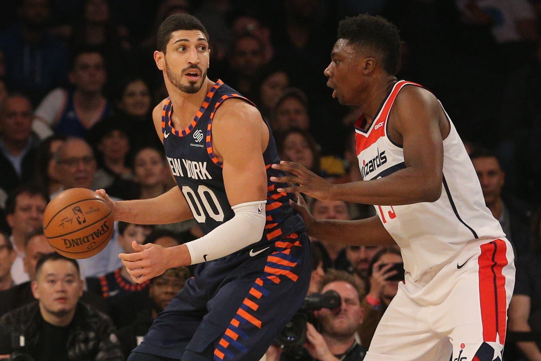 New York Knicks center Enes Kanter controls the ball against Washington Wizards center Thomas Bryant during the first quarter at Madison Square Garden. / Brad Penner/USA TODAY Sports