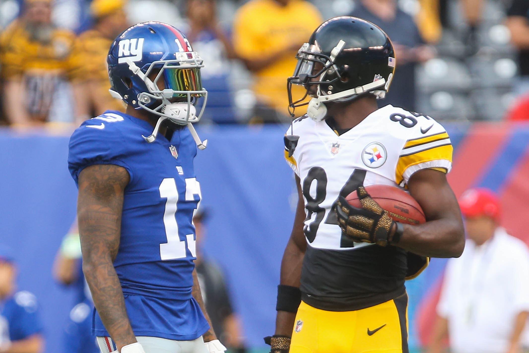 Aug 11, 2017; East Rutherford, NJ, USA; New York Giants wide receiver Odell Beckham Jr. (13) and Pittsburgh Steelers wide receiver Antonio Brown (84) talk during the pregame warmups for their game at MetLife Stadium. Mandatory Credit: Ed Mulholland-USA TODAY Sports / Ed Mulholland