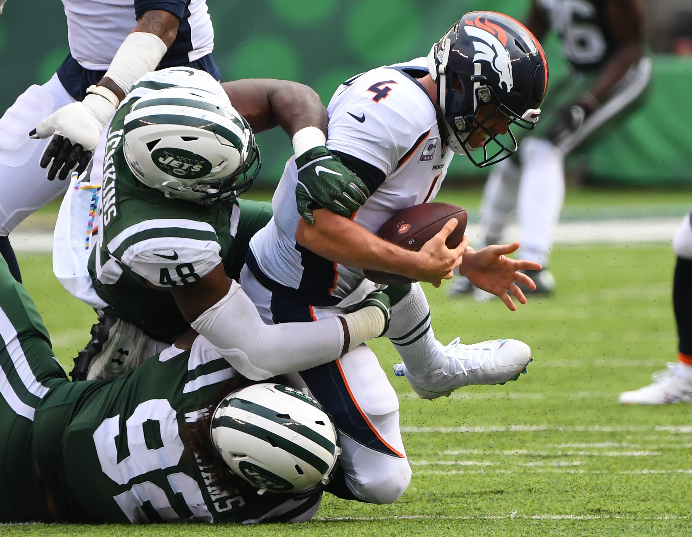 New York Jets defensive end Leonard Williams and Jets linebacker Jordan Jenkins sack Denver Broncos quarterback Case Keenum in the third quarter at MetLife Stadium. / Robert Deutsch/USA TODAY Sports