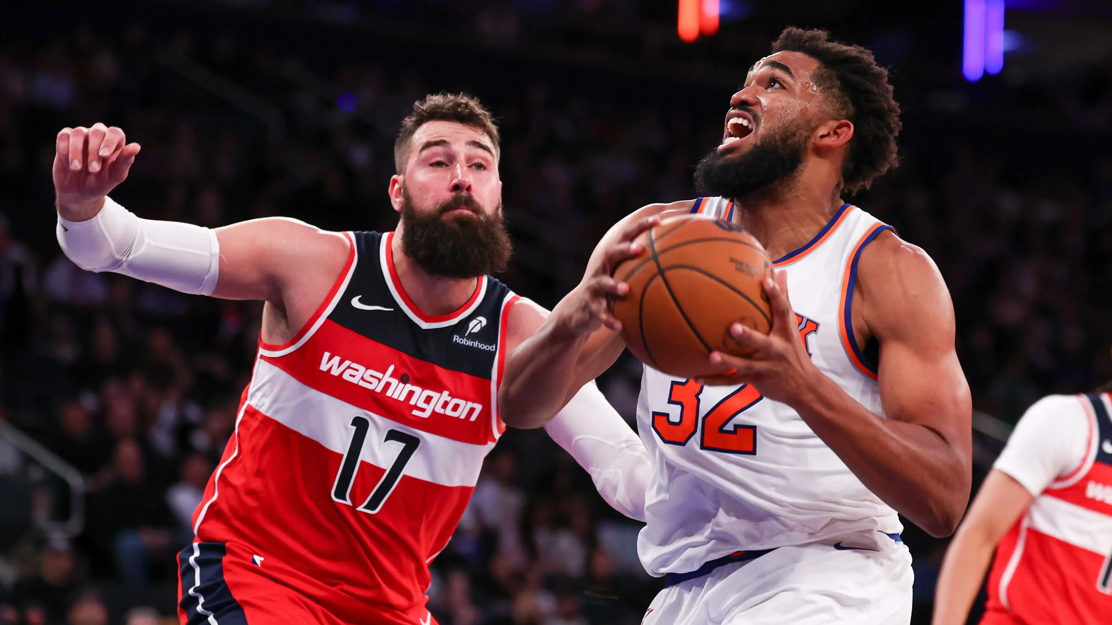 New York, New York, USA; New York Knicks center Karl-Anthony Towns (32) drives to the basket against Washington Wizards center Jonas Valanciunas (17) during the second half at Madison Square Garden. / Vincent Carchietta - Imagn Images