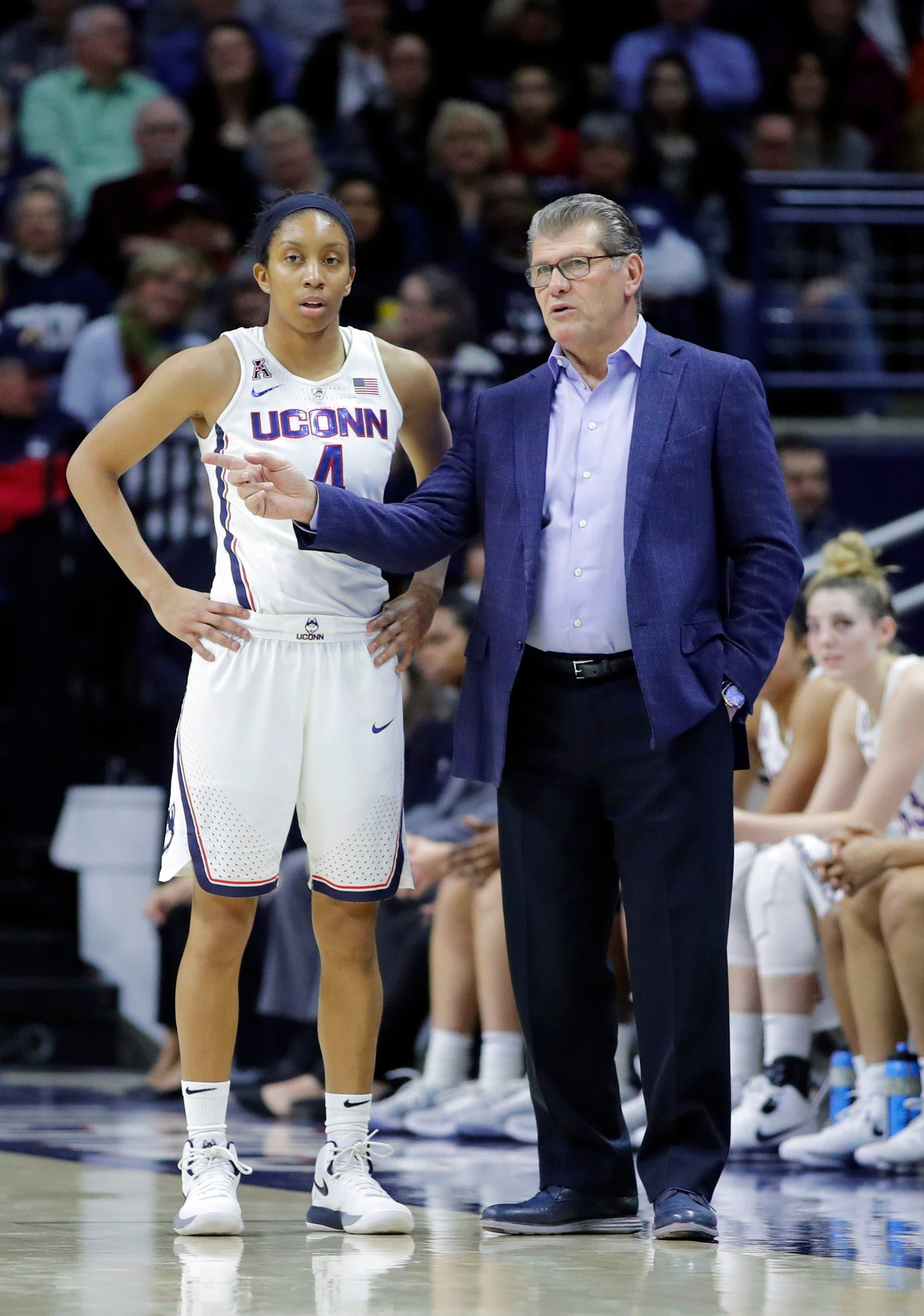 Jan 18, 2018; Storrs, CT, USA; Connecticut Huskies head coach Geno Auriemma talks with guard Mikayla Coombs (4) from the sideline as they take on the Tulsa Golden Hurricane in the first half at Gampel Pavilion. Mandatory Credit: David Butler II-USA TODAY Sports / David Butler II