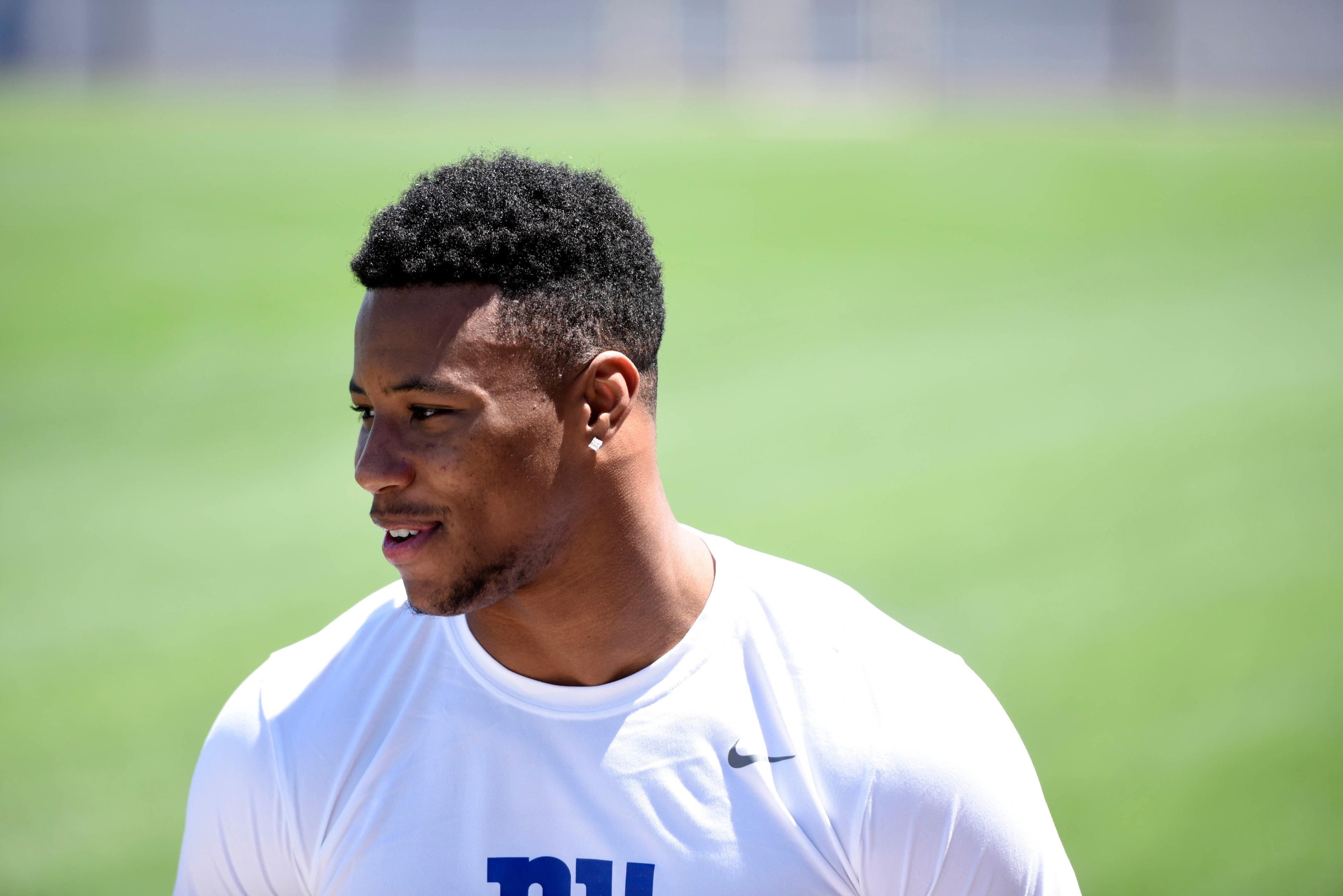 May 11, 2018; East Rutherford, NJ, USA; New York Giants rookie running back Saquon Barkley speaks to a reporter before rookie minicamp at the Quest Diagnostics Training Center. Mandatory Credit: Danielle Parhizkaran-USA TODAY SPORTS / Danielle Parhizkaran