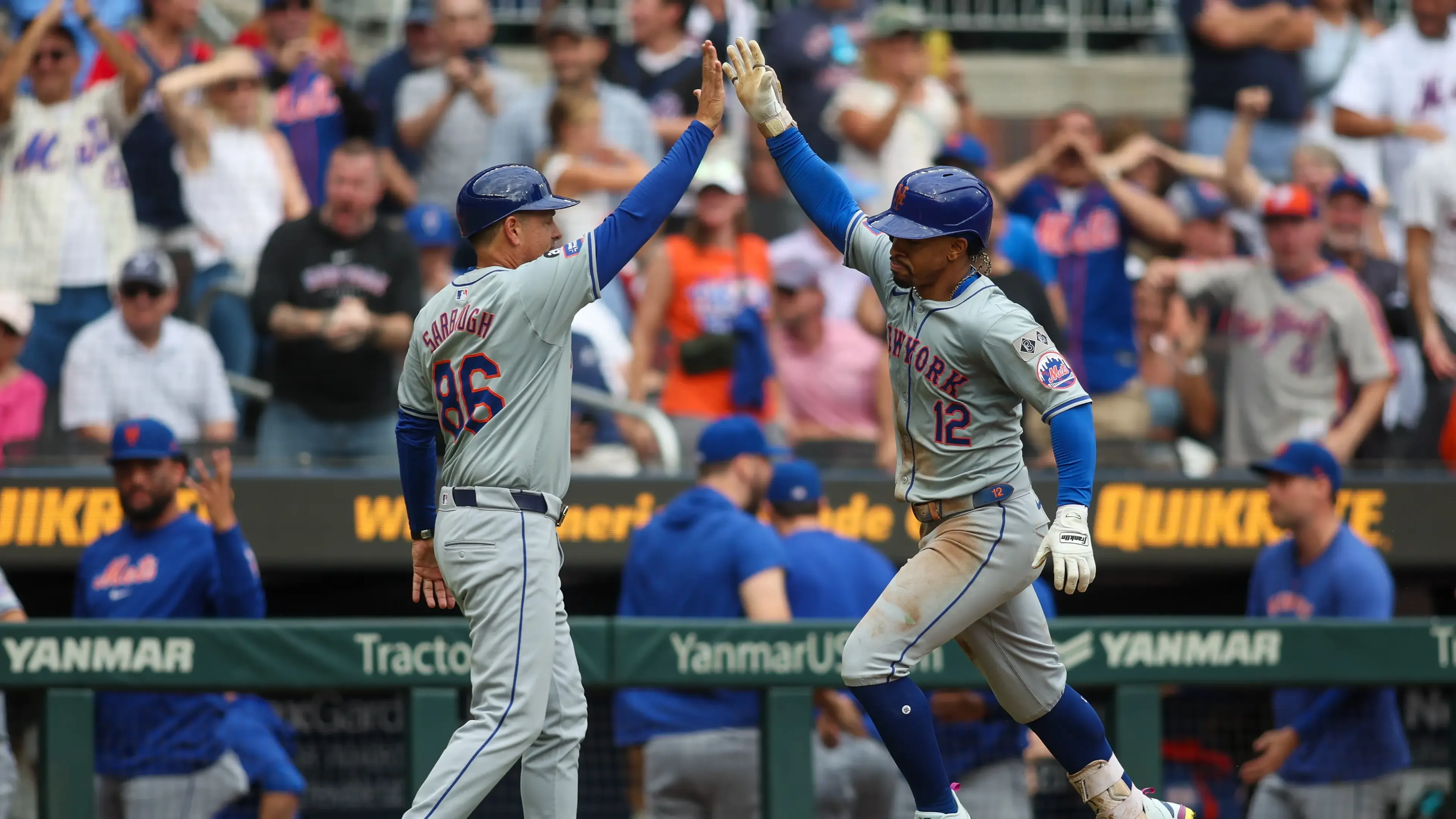 Sep 30, 2024; Atlanta, Georgia, USA; New York Mets shortstop Francisco Lindor (12) celebrates after a home run with third base coach Mike Sarbaugh (86) against the Atlanta Braves in the ninth inning at Truist Park. Mandatory Credit: Brett Davis-Imagn Images / © Brett Davis-Imagn Images