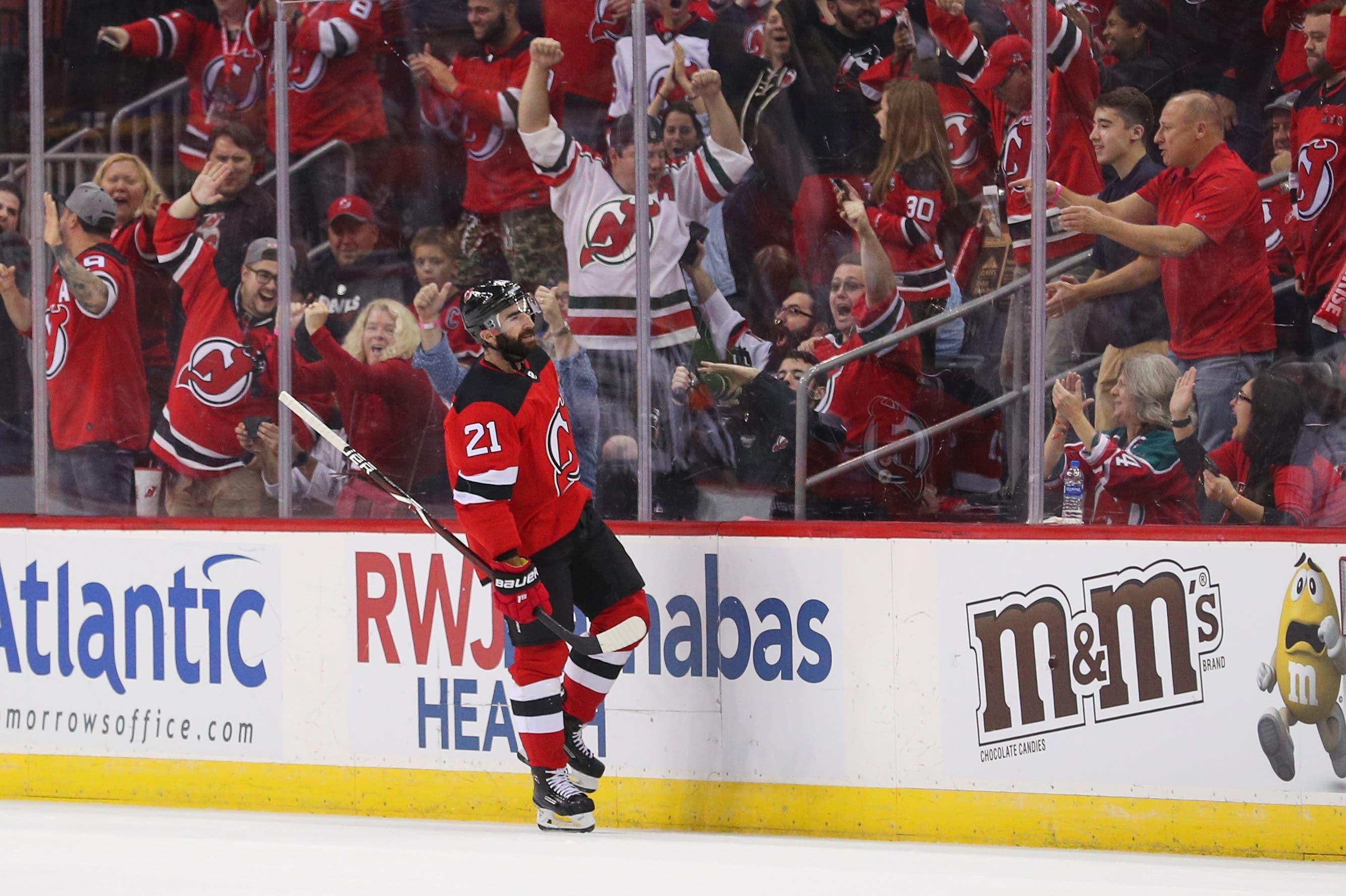 Oct 11, 2018; Newark, NJ, USA; New Jersey Devils right wing Kyle Palmieri (21) celebrates after scoring a goal during the first period against the Washington Capitals at Prudential Center. Mandatory Credit: Ed Mulholland-USA TODAY Sports / Ed Mulholland