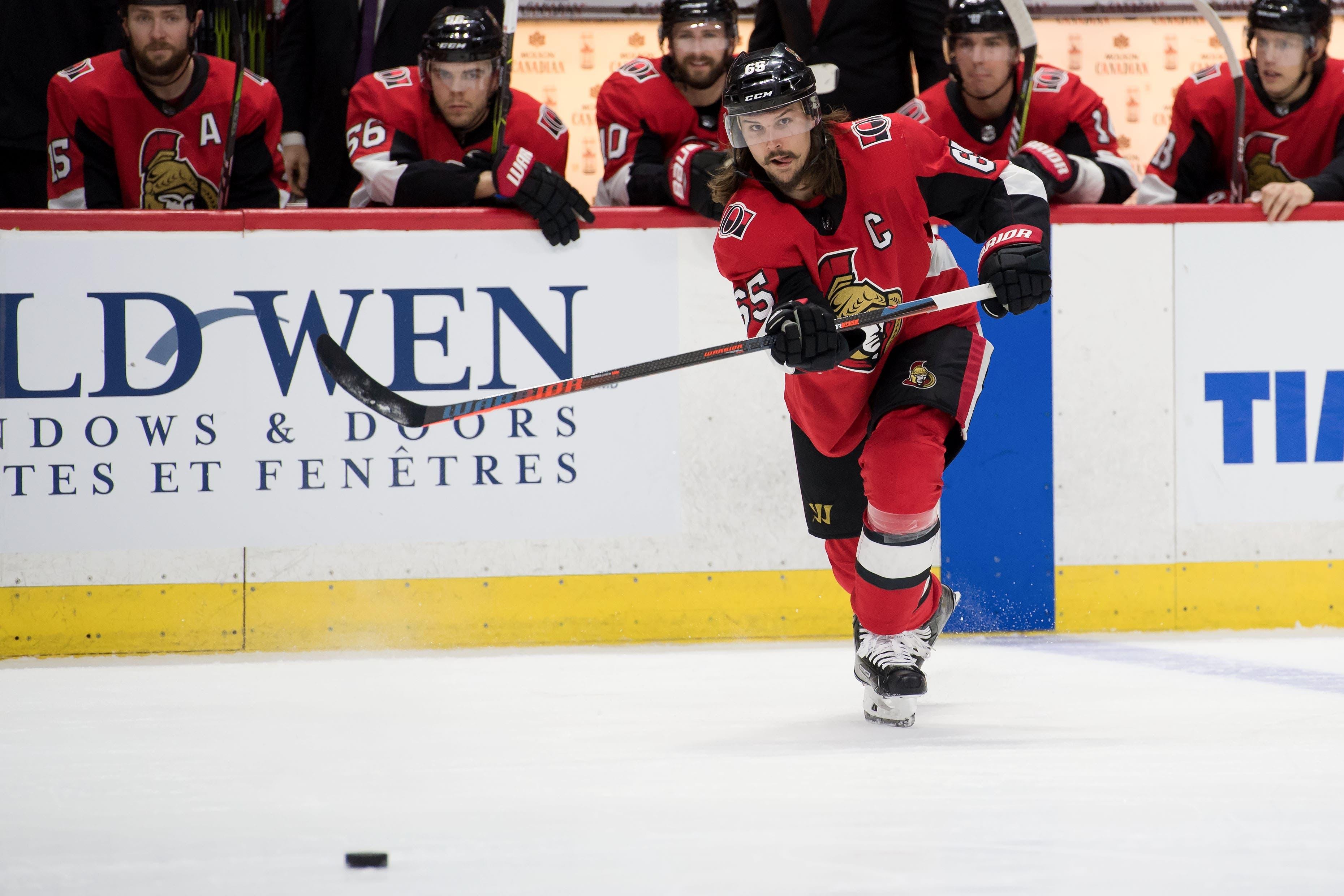 Apr 2, 2018; Ottawa, Ontario, CAN; Ottawa Senators defenseman Erik Karlsson (65) shoots the puck the puck in the second period against the Winnipeg Jets at Canadian Tire Centre. Mandatory Credit: Marc DesRosiers-USA TODAY Sports / Marc DesRosiers