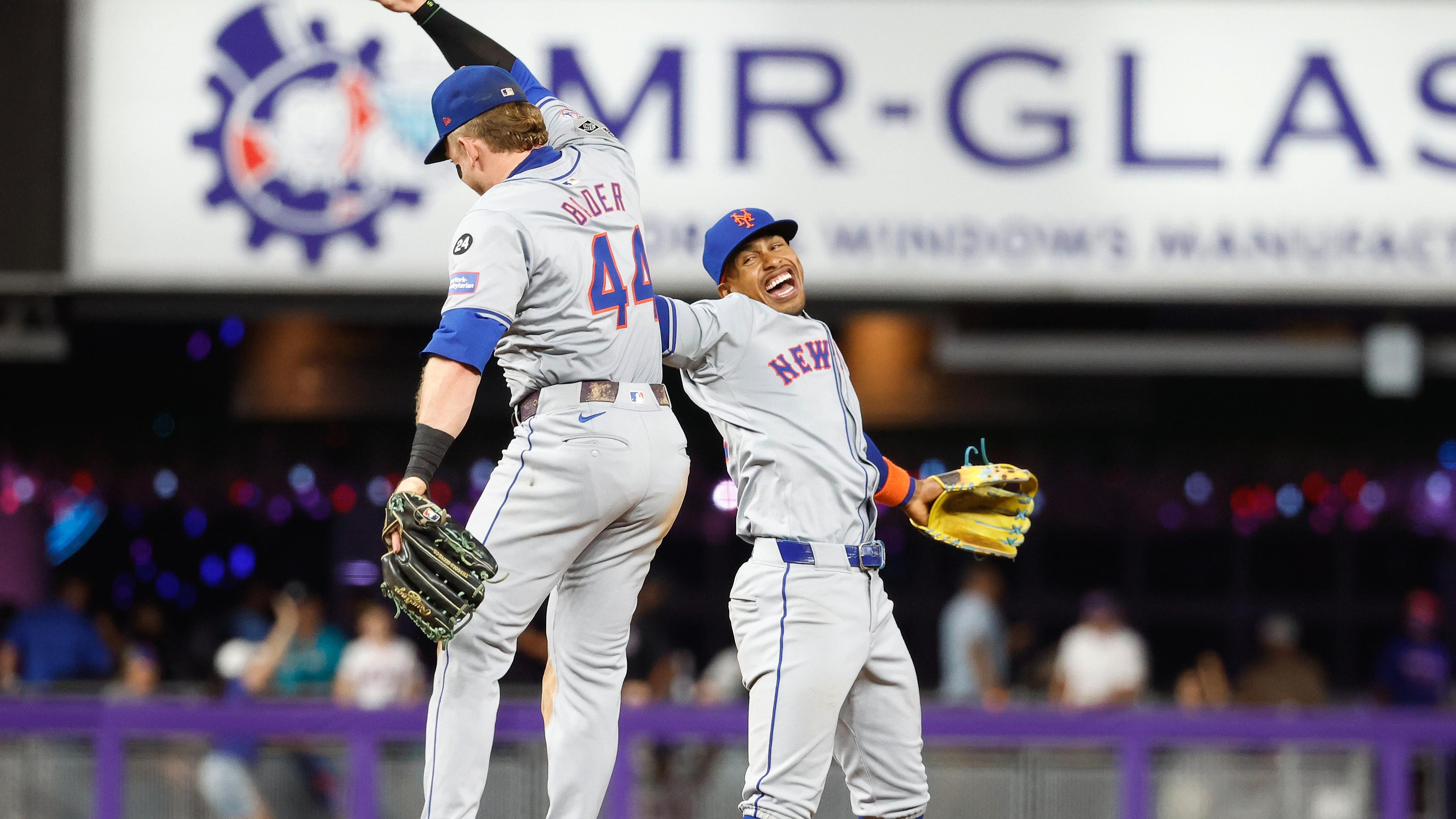 New York Mets shortstop Francisco Lindor (12) and center fielder Harrison Bader (44) celebrate their win against the Miami Marlins at loanDepot Park