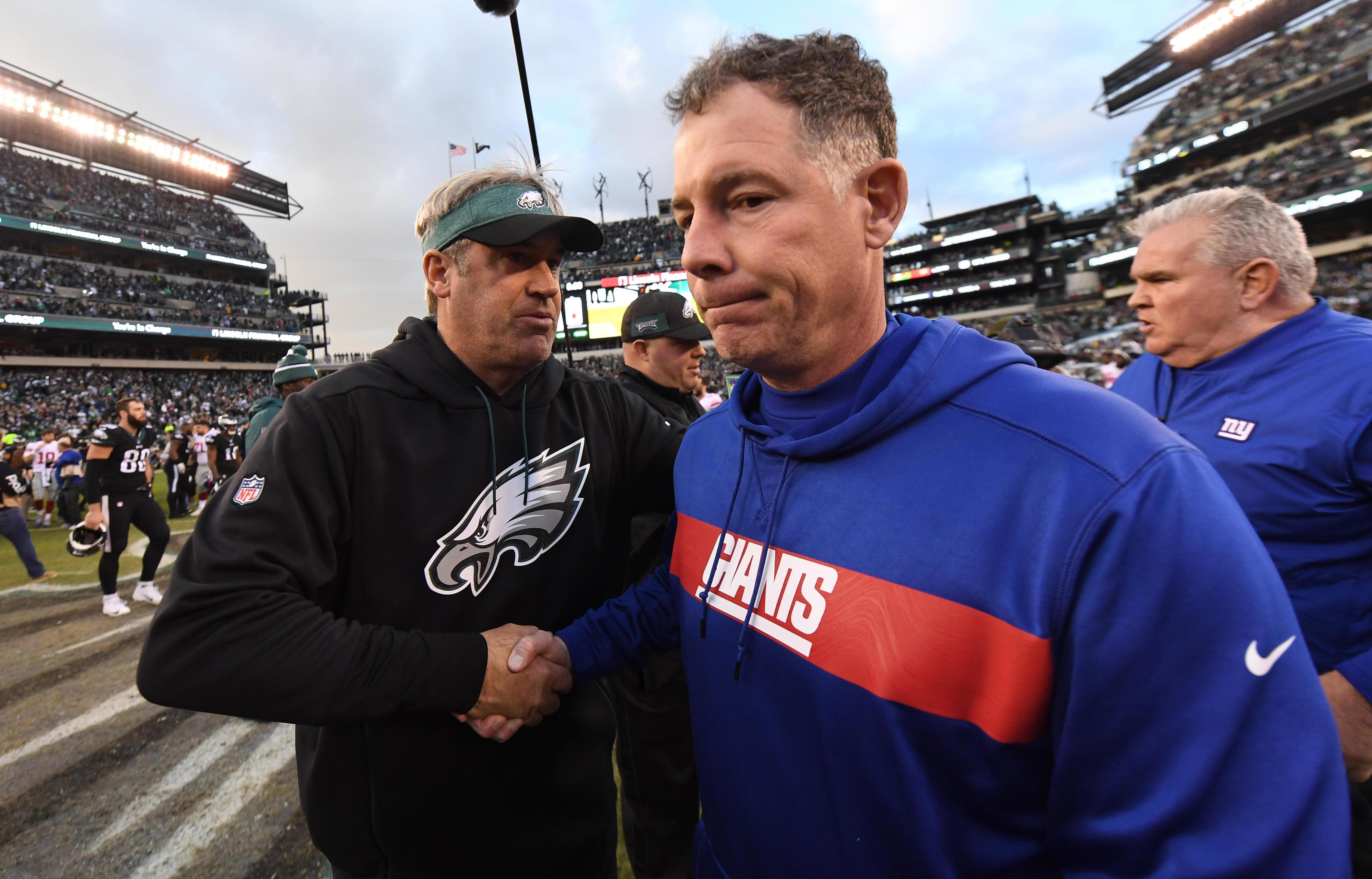 Philadelphia Eagles head coach Doug Pederson shakes hands with New York Giants head coach Pat Shurmur at Lincoln Financial Field. / James Lang/USA TODAY Sports