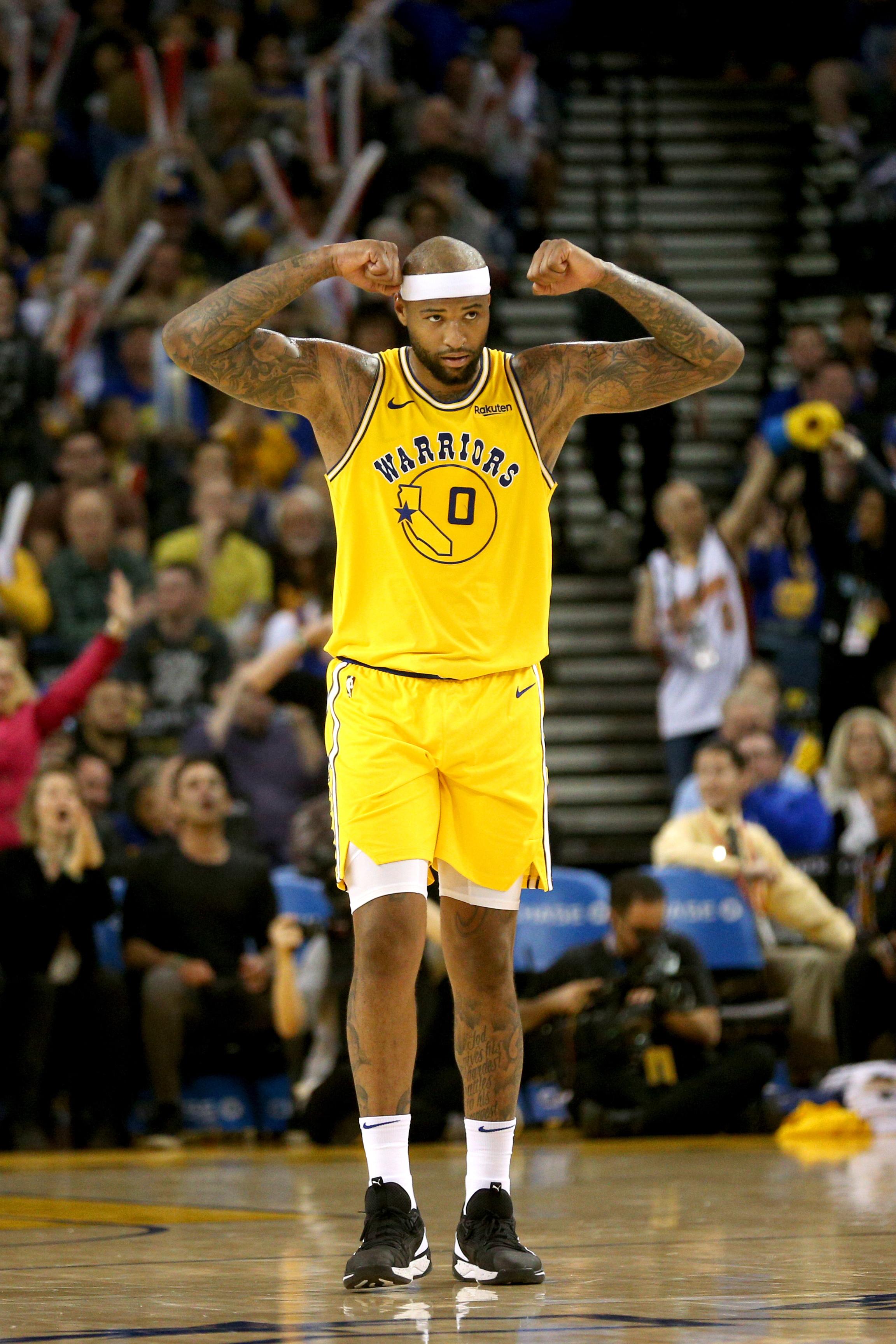 Mar 21, 2019; Oakland, CA, USA; Golden State Warriors center DeMarcus Cousins (0) reacts after forward Draymond Green (not pictured) made a shot while being fouled against the Indiana Pacers in the third quarter at Oracle Arena. Mandatory Credit: Cary Edmondson-USA TODAY Sports