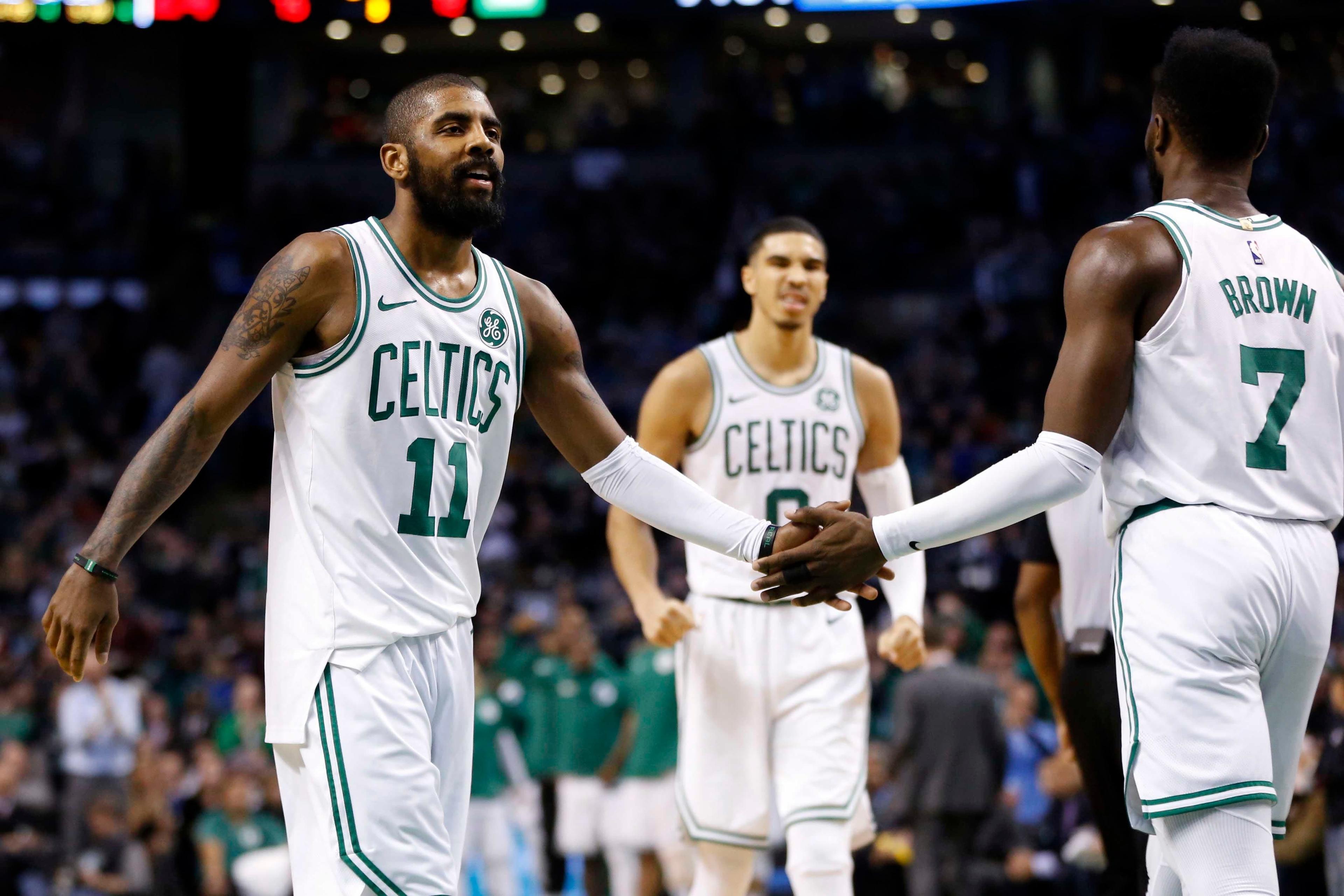 Jan 16, 2018; Boston, MA, USA; Boston Celtics guard Kyrie Irving (11) congratulates guard Jaylen Brown (7) after a score during the second half against the New Orleans Pelicans at TD Garden. Mandatory Credit: Greg M. Cooper-USA TODAY Sports / Greg M. Cooper