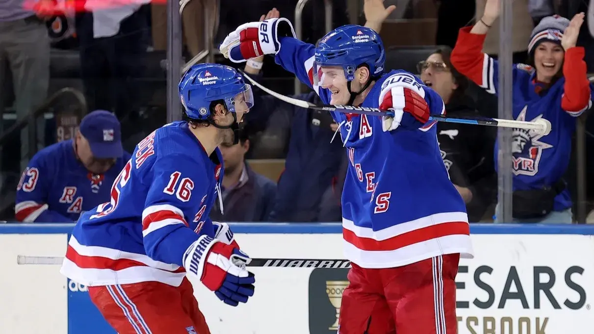 Mar 26, 2024; New York, New York, USA; New York Rangers defenseman Adam Fox (23) celebrates his game winning goal against the Philadelphia Flyers with center Vincent Trocheck (16) during overtime at Madison Square Garden. / Brad Penner-USA TODAY Sports