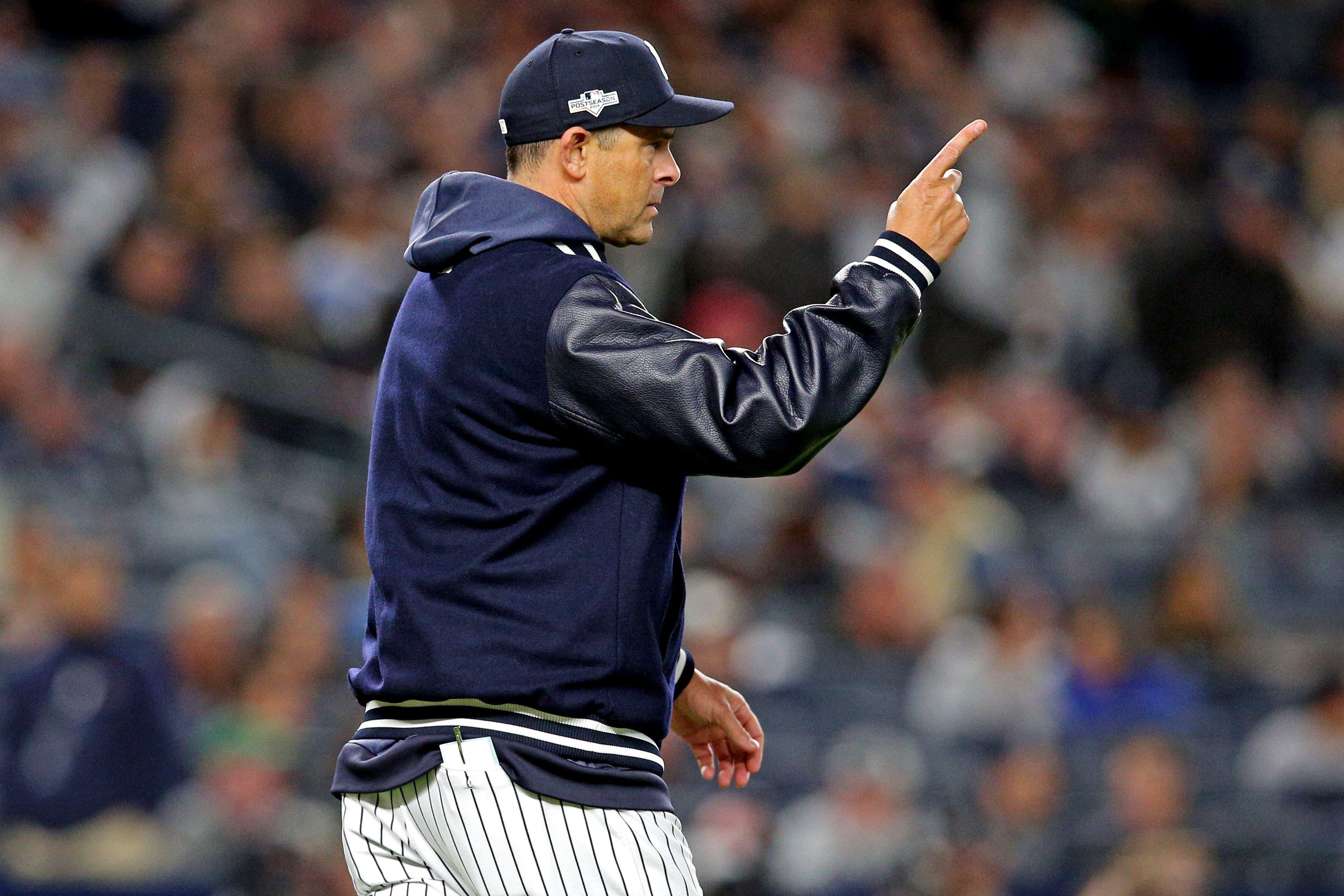 Oct 4, 2019; Bronx, NY, USA; New York Yankees manager Aaron Boone calls for a pitching change during the sixth inning against the Minnesota Twins in game one of the 2019 ALDS playoff baseball series at Yankee Stadium. Mandatory Credit: Brad Penner-USA TODAY Sports / Brad Penner