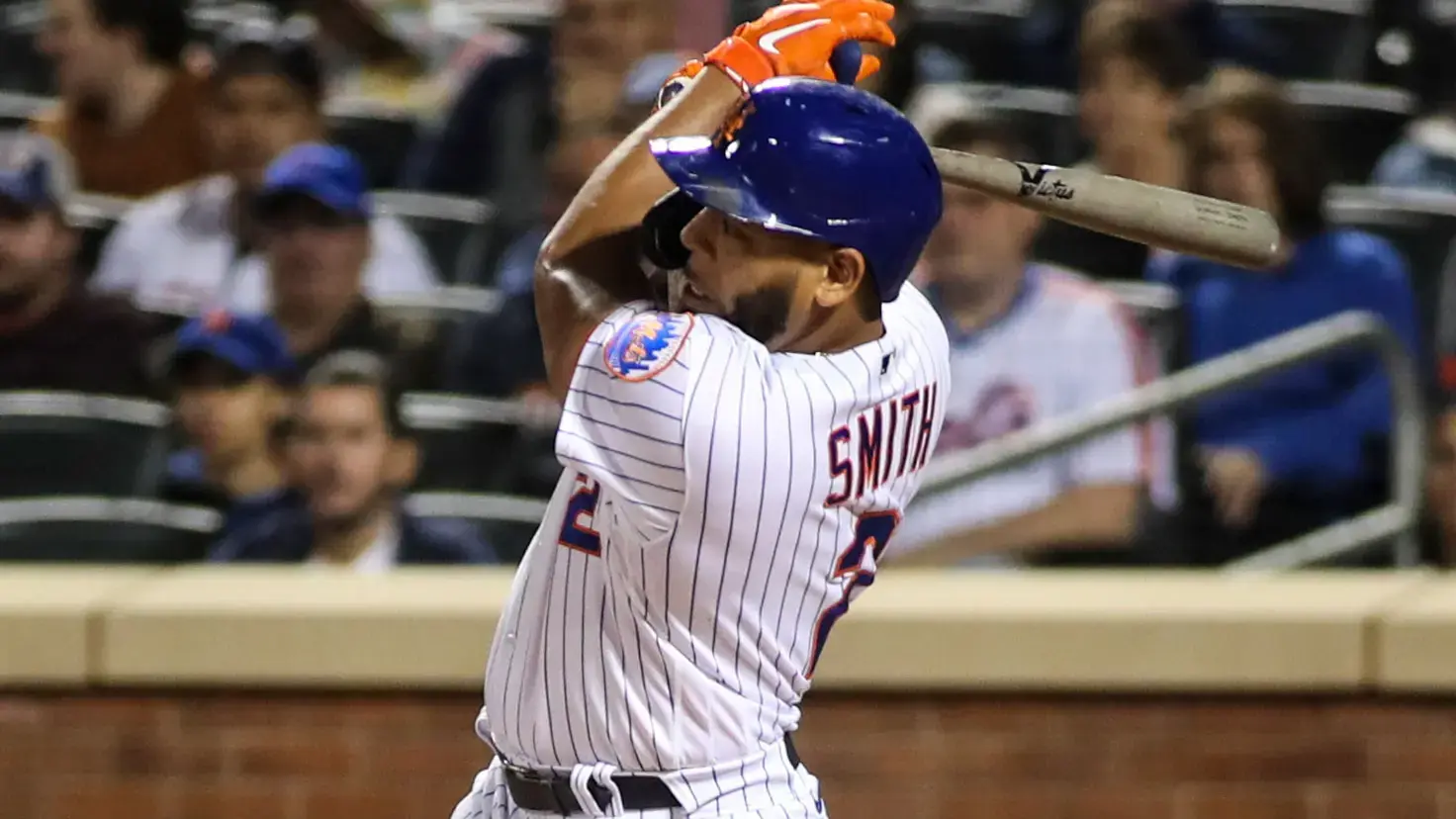 Sep 2, 2021; New York City, New York, USA; New York Mets pinch hitter Dominic Smith (2) hits an RBI single in the seventh inning against the Miami Marlins at Citi Field.