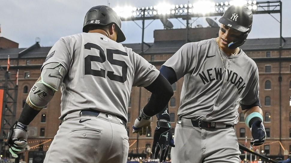 Jul 12, 2024; Baltimore, Maryland, USA; New York Yankees outfielder Aaron Judge (99) celebrates with second baseman Gleyber Torres (25) after hitting third inning home run against the Baltimore Orioles home run at Oriole Park at Camden Yards. 