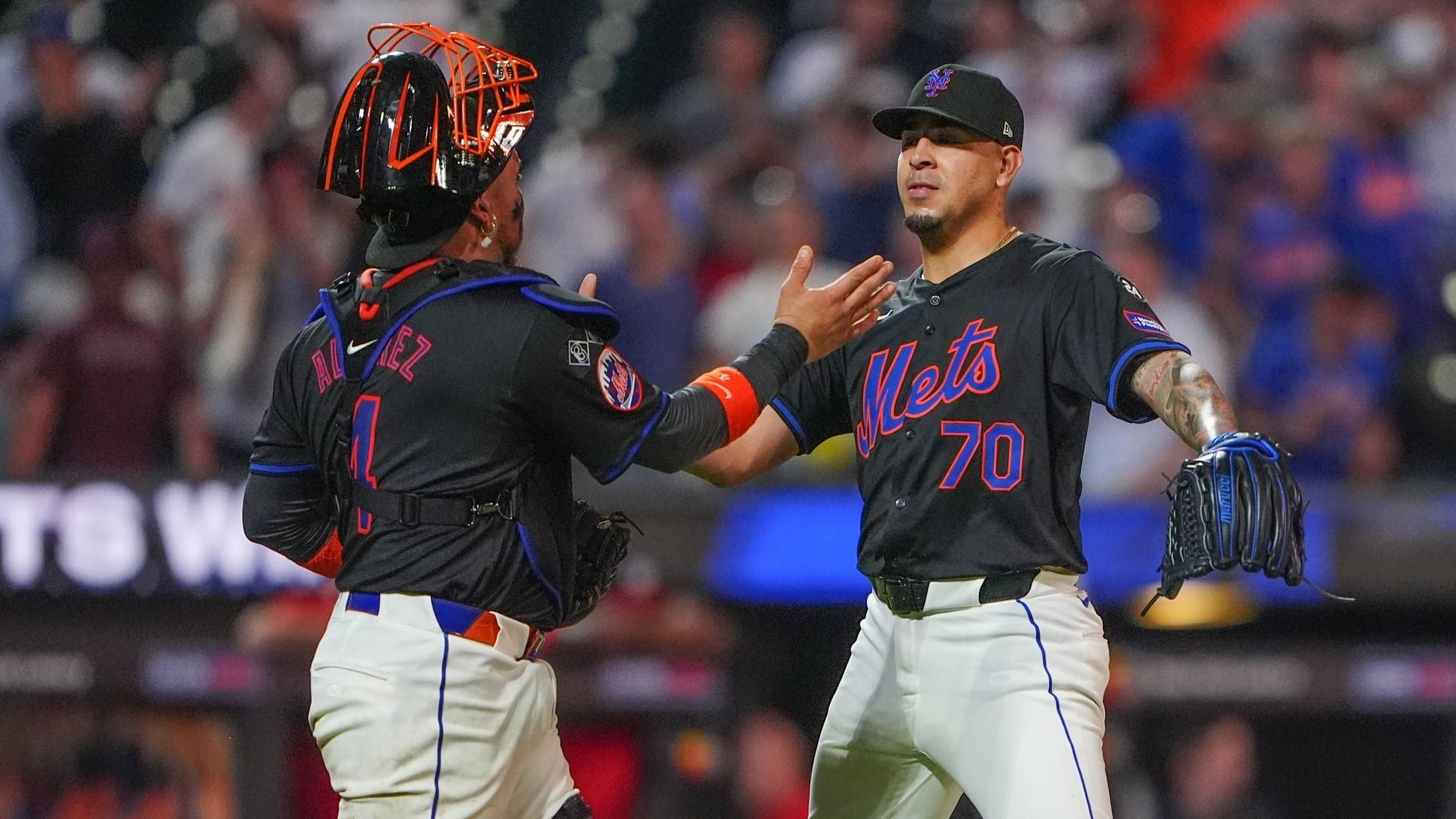 Jul 10, 2024; New York City, New York, USA; New York Mets catcher Francisco Alvarez (4) and pitcher Jose Butto (70) celebrate a victory against the Washington Nationals at Citi Field. 
