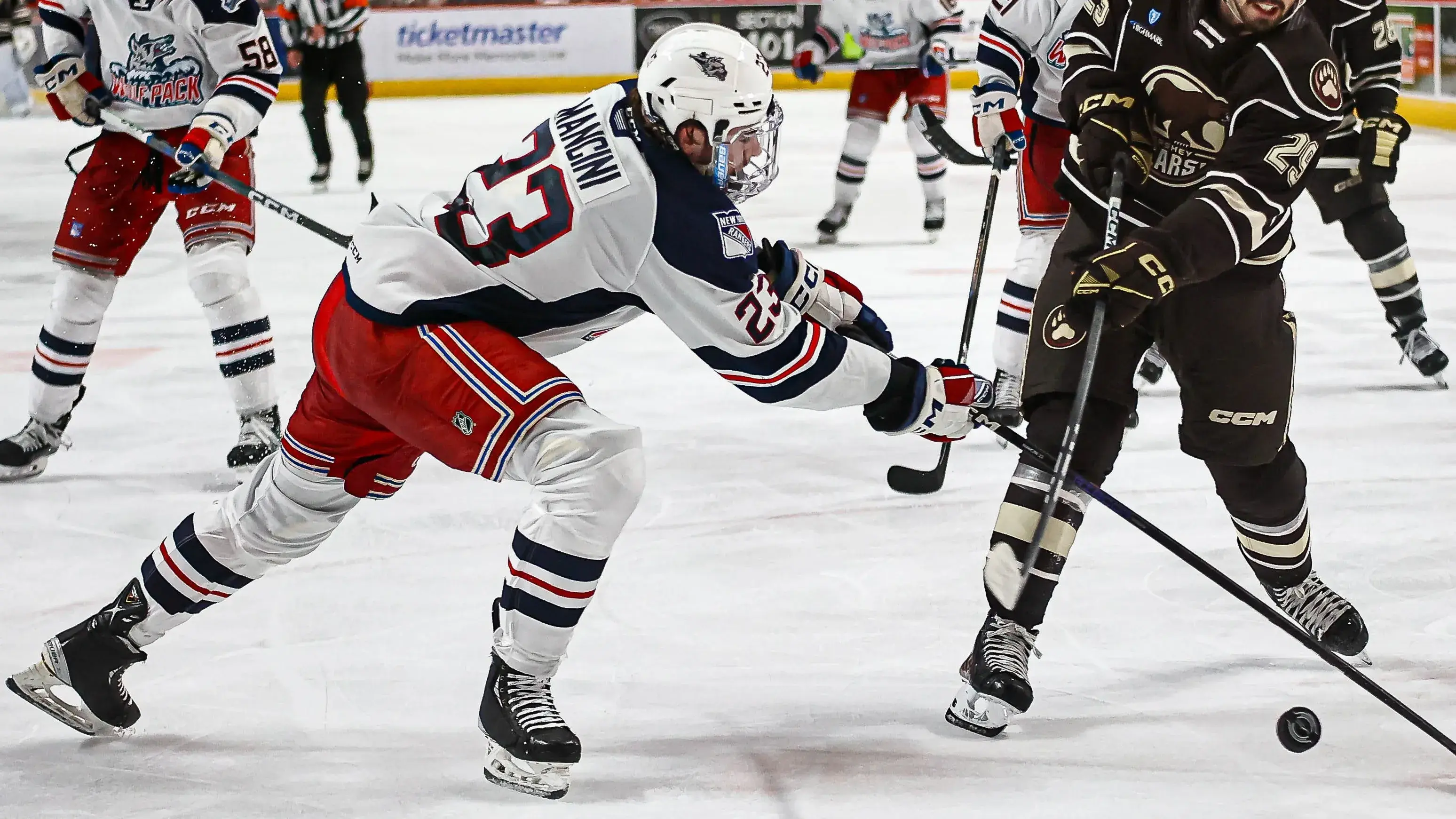 Hendrix Lapierre (29) shoots the puck as Victor Mancini (23) attempts to block it. The Hershey Bears played the Hartford Wolf Pack in the first game of their best-of-five Atlantic Division finals series Thursday, May 16, 2024 at Giant Center / Travis Boyd - For the Lebanon Daily News - USA TODAY NETWORK