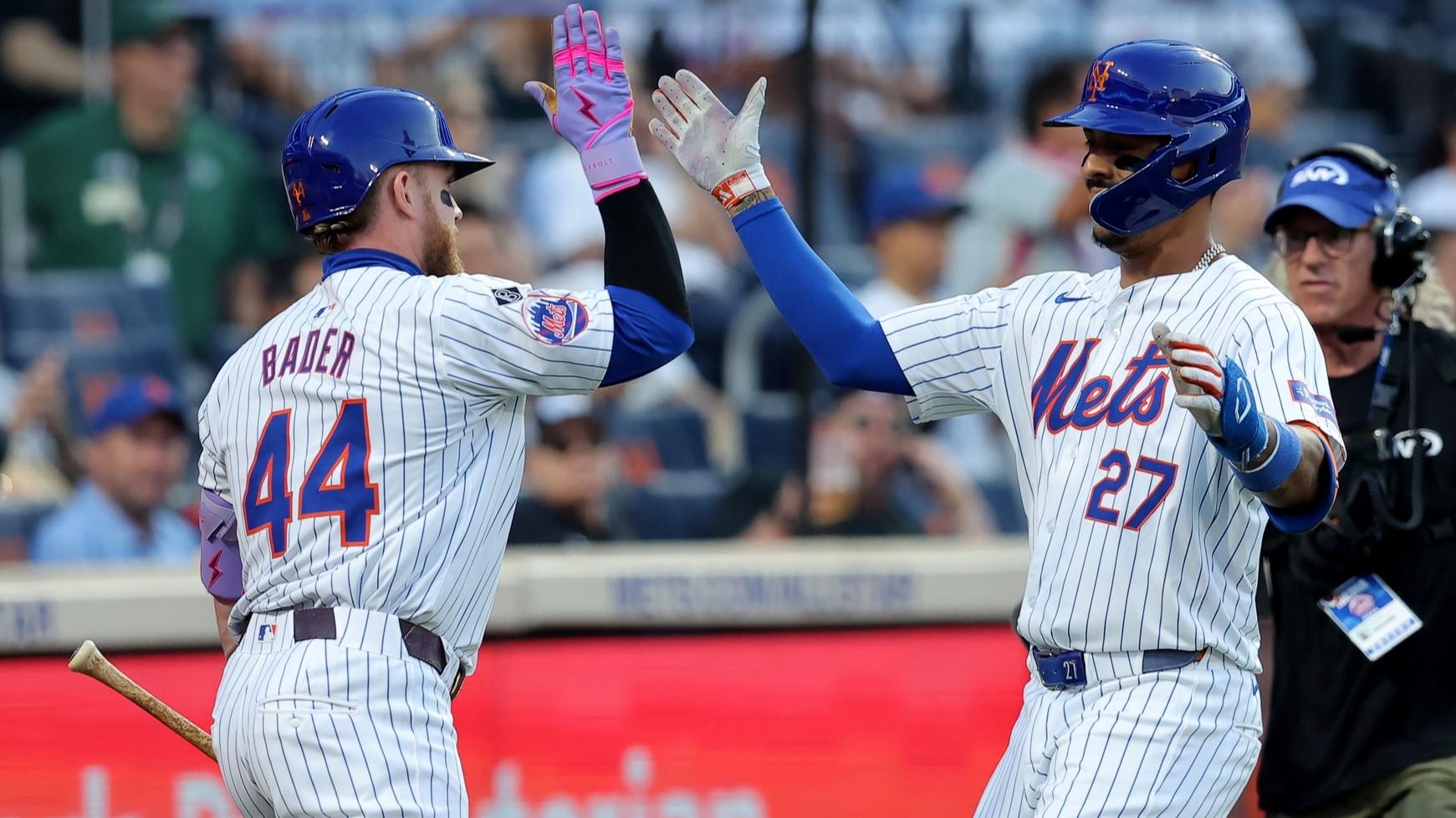 Jun 25, 2024; New York City, New York, USA; New York Mets third baseman Mark Vientos (27) celebrates his solo home run against the New York Yankees with center fielder Harrison Bader (44) during the second inning at Citi Field.