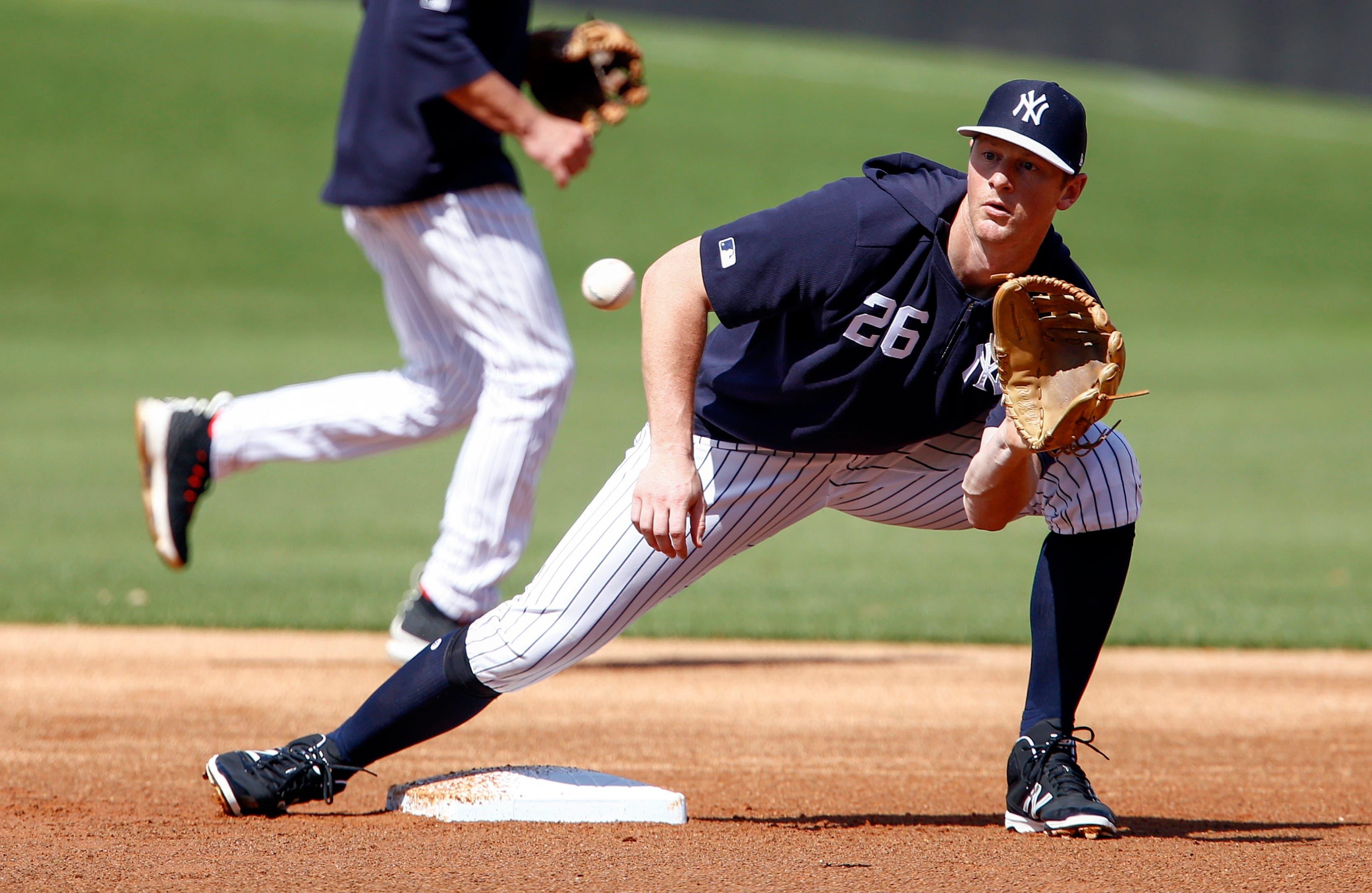 New York Yankees infielder DJ LeMahieu catches a ball thrown from home plate in a steal drill during spring training workouts at George M. Steinbrenner Field. / Reinhold Matay/USA TODAY Sports