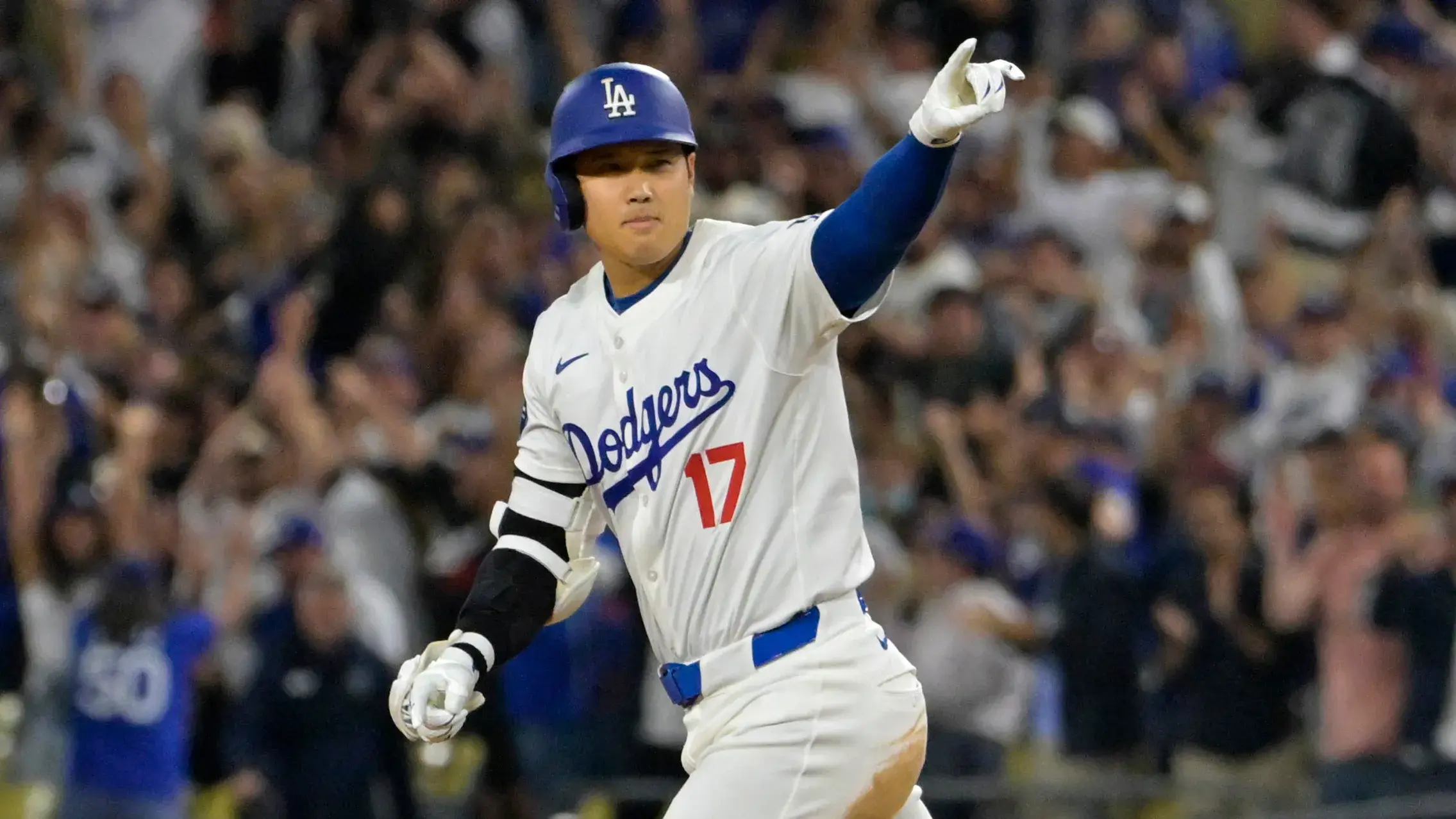 Aug 23, 2024; Los Angeles, California, USA; Los Angeles Dodgers designated hitter Shohei Ohtani (17) rounds the bases on a walk-off grand slam home run for his 40th of the season in the ninth inning against the Tampa Bay Rays at Dodger Stadium. / Jayne Kamin-Oncea - USA TODAY Sports