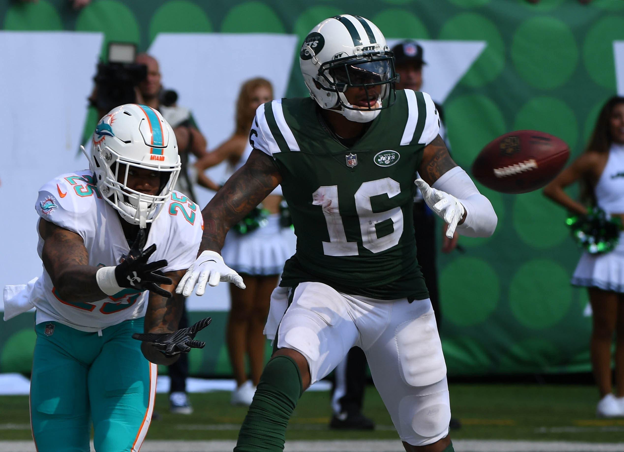 Sep 16, 2018; East Rutherford, NJ, USA; 
Miami Dolphins cornerback Xavien Howard (25) intercepts a pass intended for New York Jets wide receiver Terrelle Pryor (16) in the third quarter at MetLife Stadium. Mandatory Credit: Robert Deutsch-USA TODAY Sports / Robert Deutsch