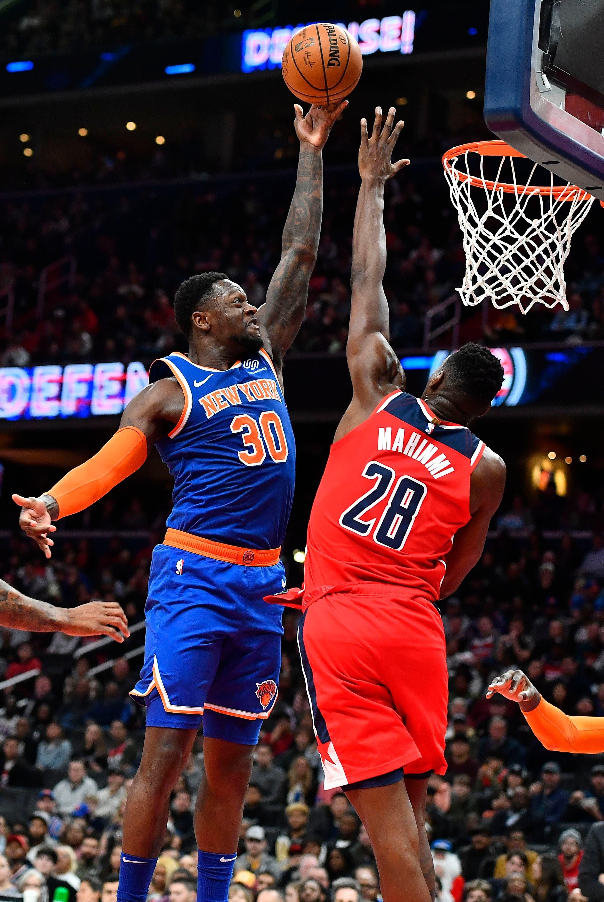 Dec 28, 2019; Washington, District of Columbia, USA; New York Knicks forward Julius Randle (30) shoots over Washington Wizards center Ian Mahinmi (28) during the second quarter at Capital One Arena. Mandatory Credit: Brad Mills-USA TODAY Sports / Brad Mills