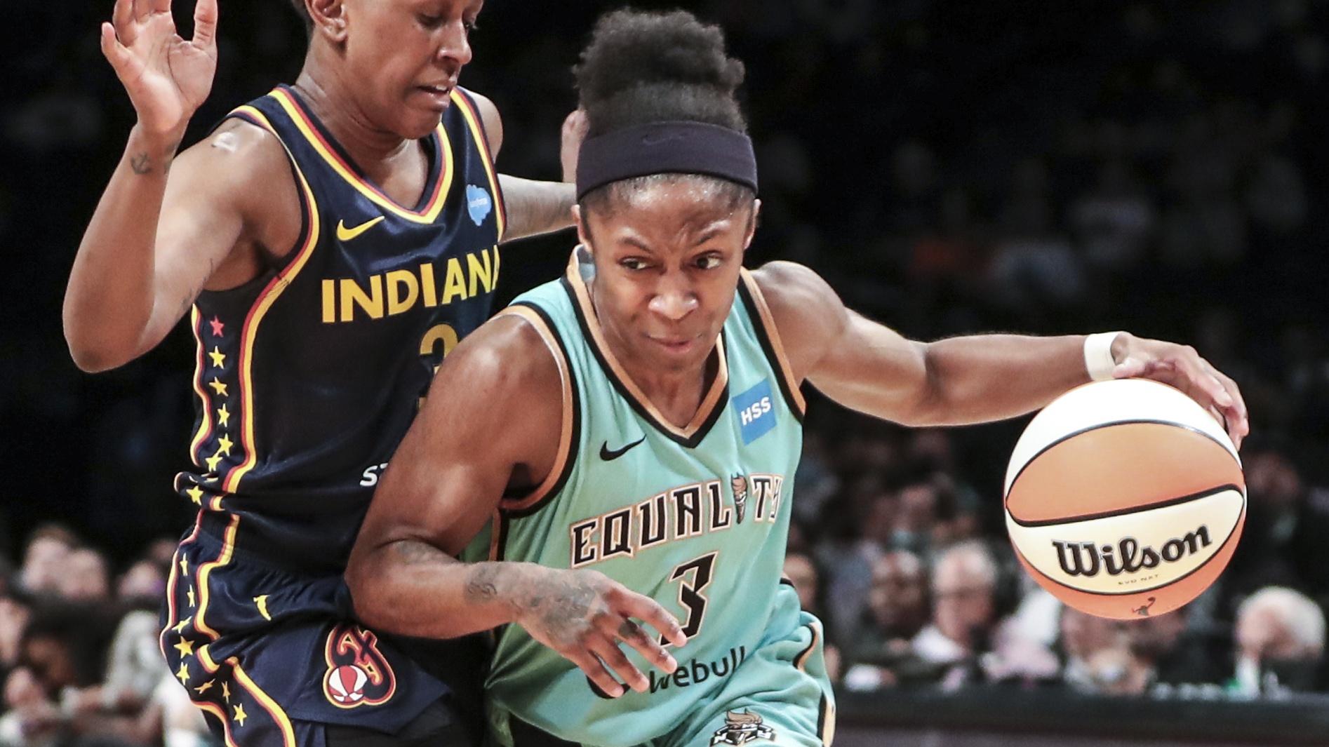 Jun 1, 2022; Brooklyn, New York, USA; New York Liberty guard Crystal Dangerfield (3) drives past Indiana Fever guard Danielle Robinson (3) in the third quarter at Barclays Center. Mandatory Credit: Wendell Cruz-USA TODAY Sports