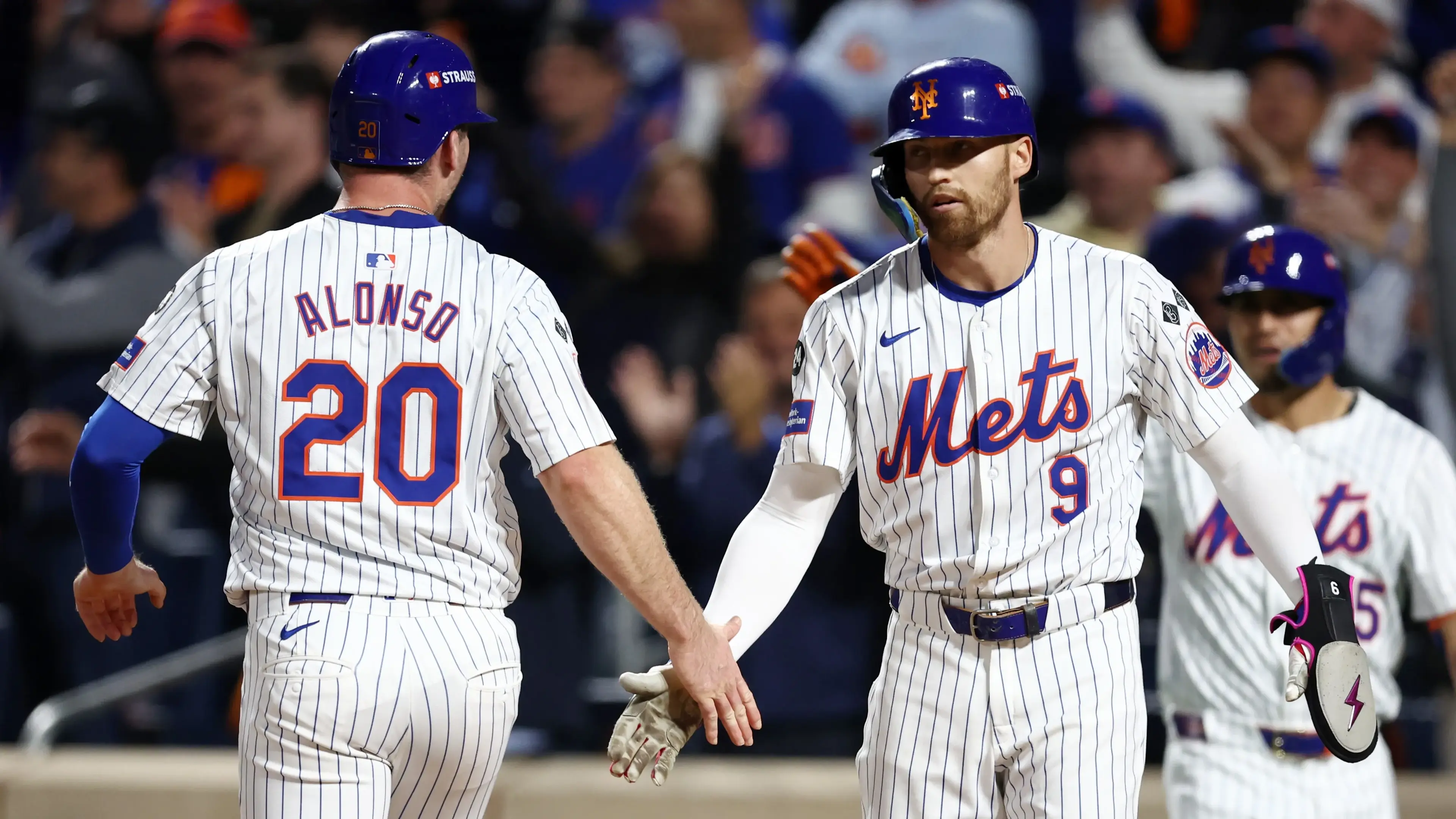 Oct 8, 2024; New York City, New York, USA; New York Mets first baseman Pete Alonso (20) celebrates scoring with outfielder Brandon Nimmo (9) on a two run single by outfielder Starling Marte (not pictured) in the sixth inning against the Philadelphia Phillies during game three of the NLDS for the 2024 MLB Playoffs at Citi Field. / Vincent Carchietta - Imagn Images