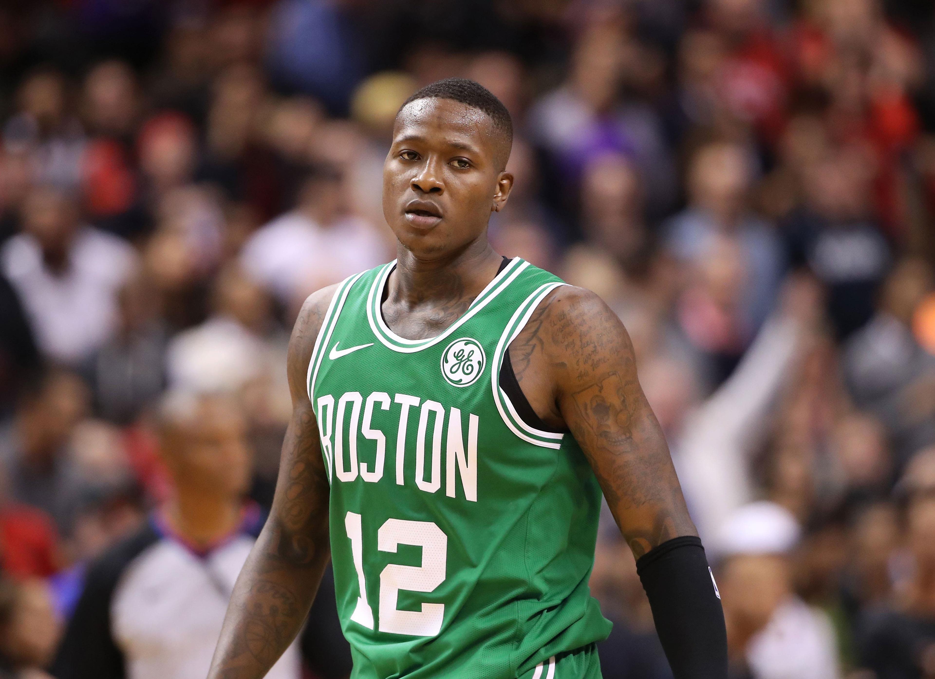 Oct 19, 2018; Toronto, Ontario, CAN; Boston Celtics guard Terry Rozier (12) looks on against the Toronto Raptors at Scotiabank Arena. The Raptors beat the Celtics 113-101. Mandatory Credit: Tom Szczerbowski-USA TODAY Sports / Tom Szczerbowski