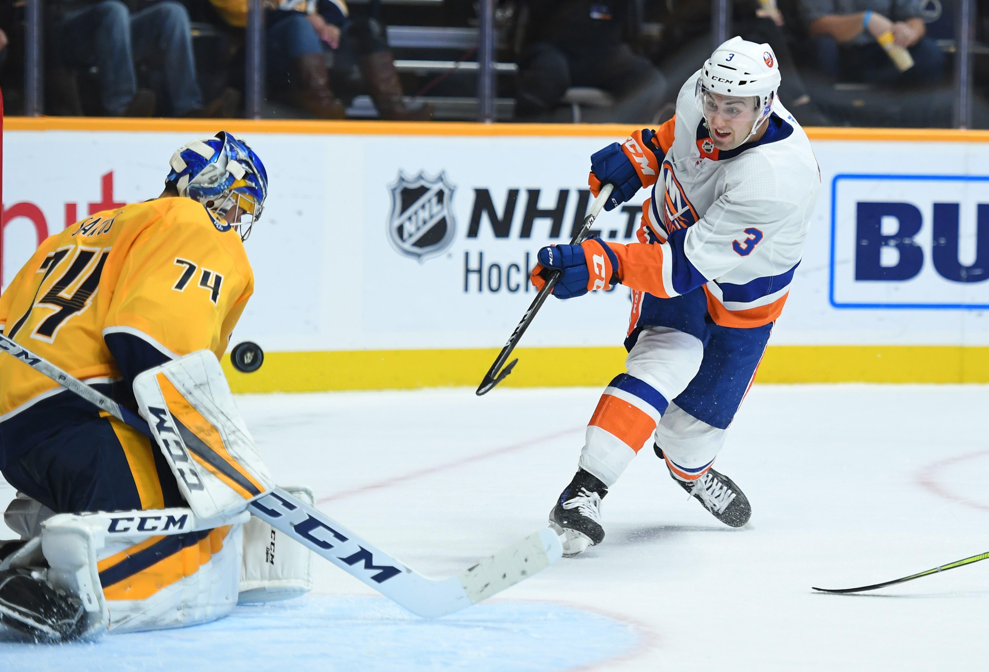 Oct 13, 2018; Nashville, TN, USA; New York Islanders defenseman Adam Pelech (3) has his shot blocked by Nashville Predators goaltender Juuse Saros (74) during the second period at Bridgestone Arena. Mandatory Credit: Christopher Hanewinckel-USA TODAY Sports / Christopher Hanewinckel