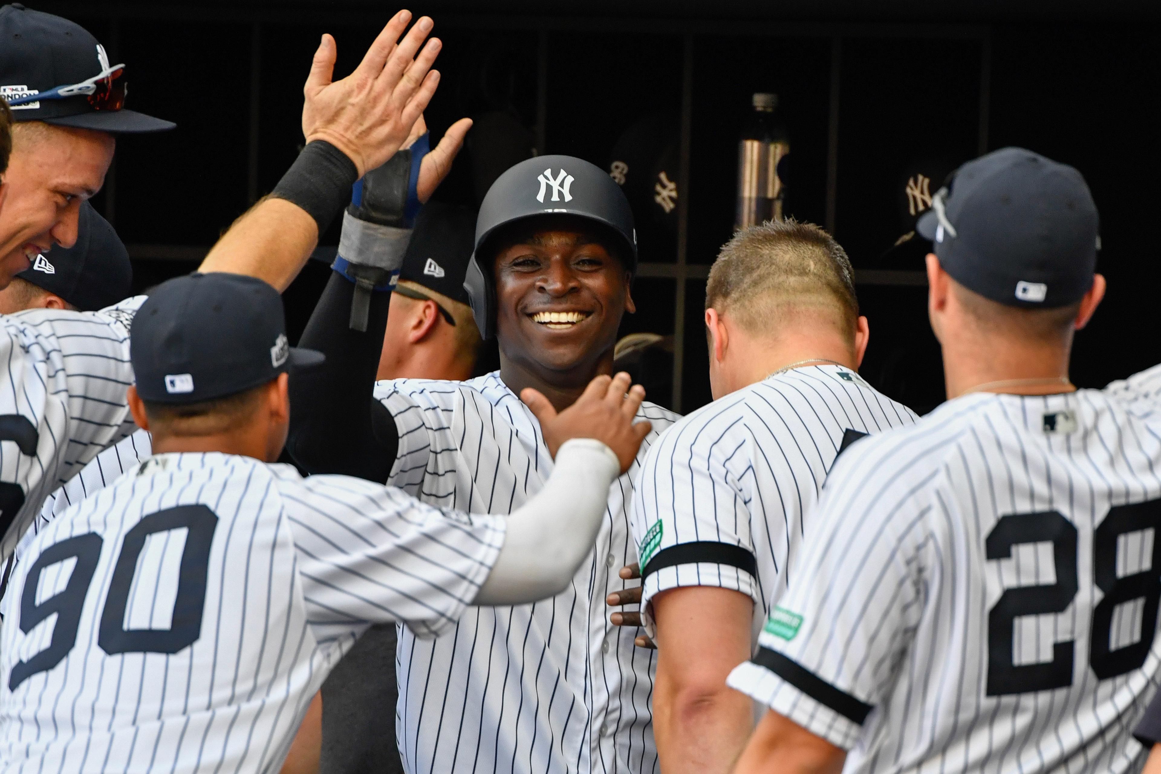 Jun 29, 2019; London, ENG; New York Yankees shortstop Didi Gregorius (18) celebrates his run with his team mates during the first inning against the Boston Red Sox at London Stadium. Mandatory Credit: Steve Flynn-USA TODAY Sports