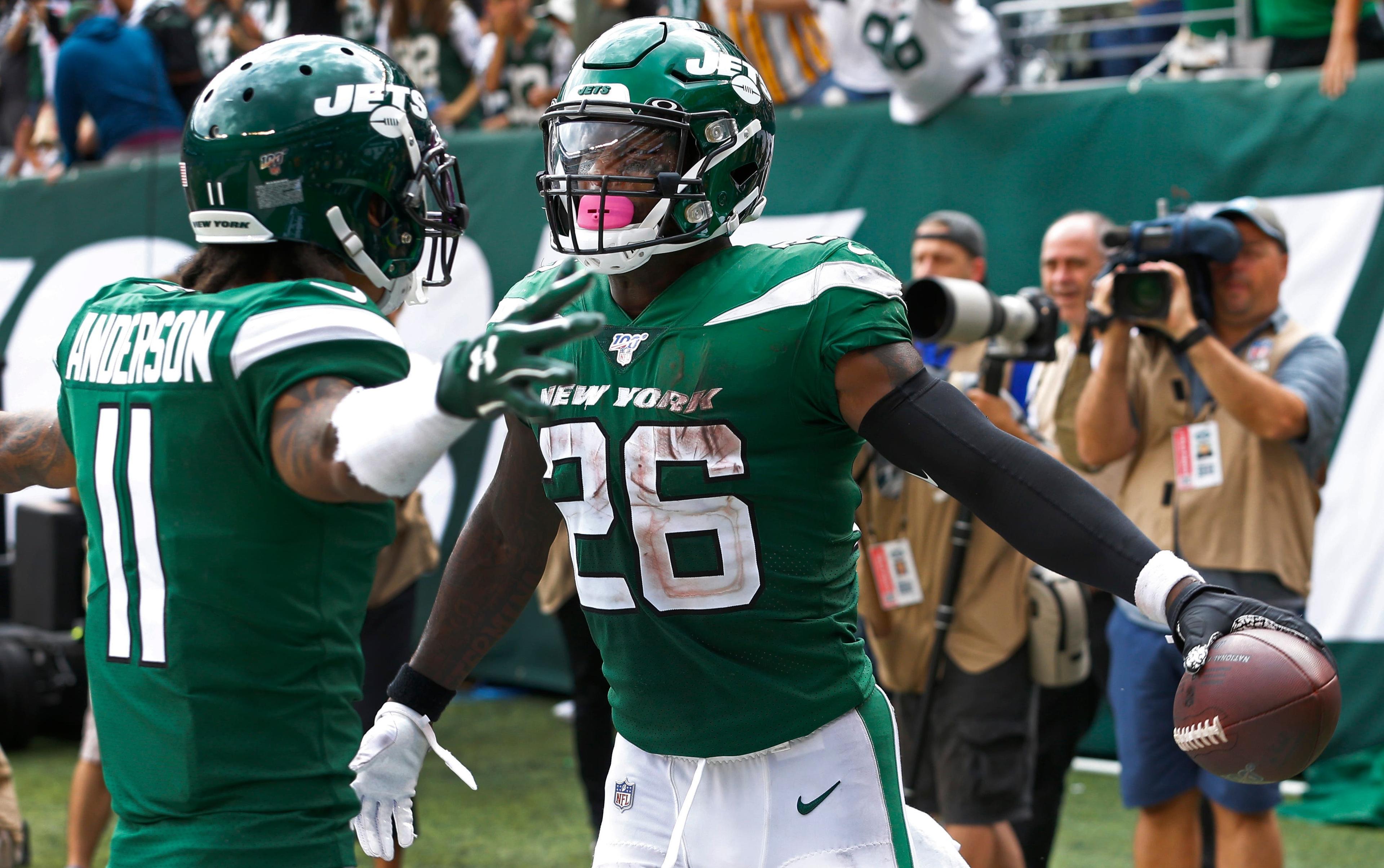 Sep 8, 2019; East Rutherford, NJ, USA; New York Jets running back Le'Veon Bell (26) celebrates with New York Jets wide receiver Robby Anderson (11) after scoring a touchdown against the Buffalo Bills during the second half at MetLife Stadium. Mandatory Credit: Noah K. Murray-USA TODAY Sports / Noah K. Murray