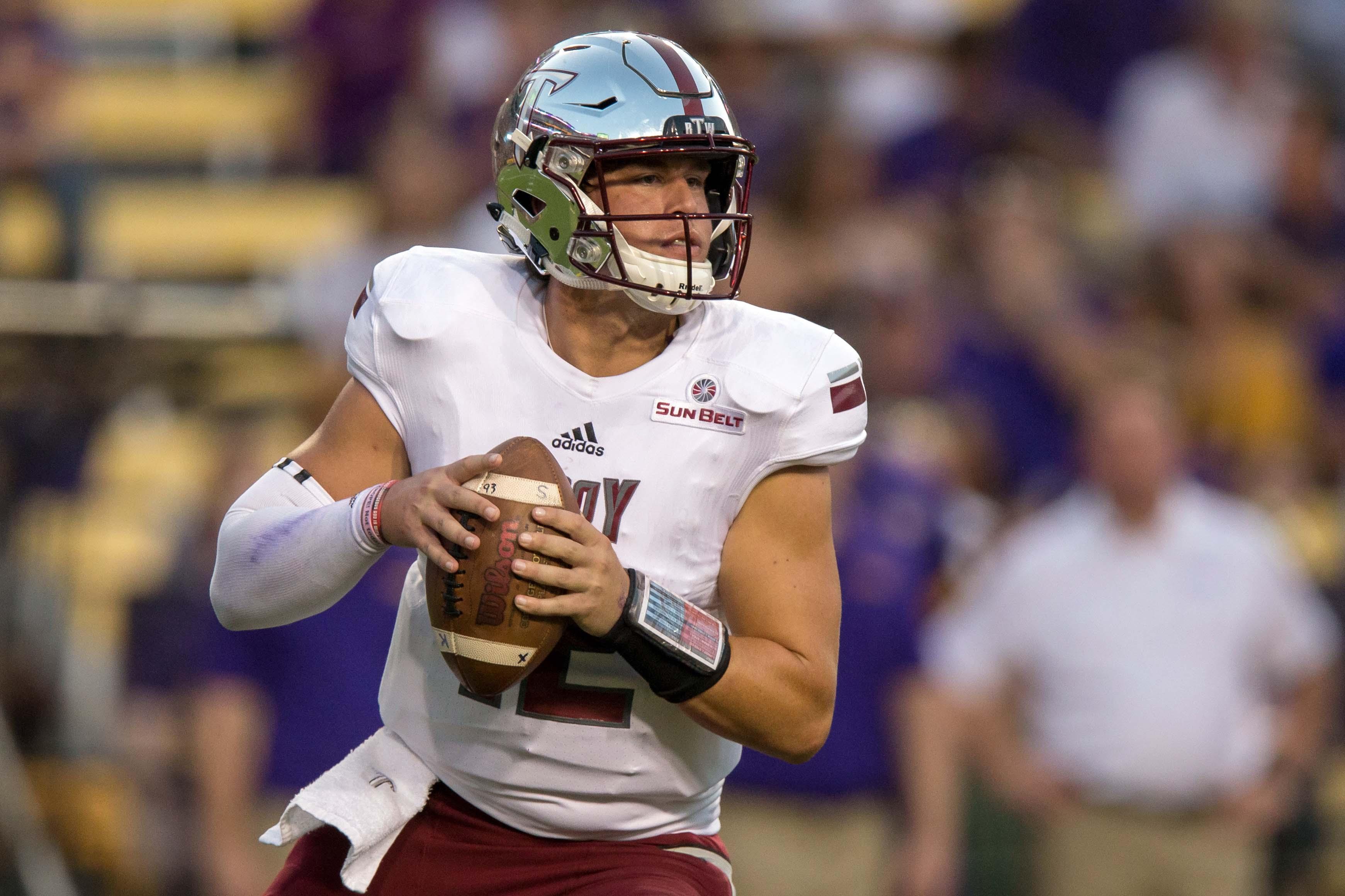 Sep 30, 2017; Baton Rouge, LA, USA; Troy Trojans quarterback Brandon Silvers (12) looks to pass downfield during the game between the LSU Tigers and the Troy Trojans at Tiger Stadium. Mandatory Credit: Stephen Lew-USA TODAY Sports