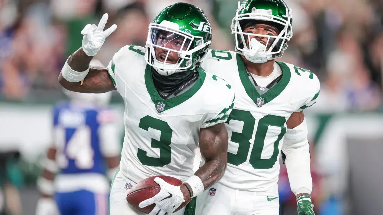 New York Jets safety Jordan Whitehead (3) celebrates after an interception with cornerback Michael Carter II (30) during the second half against the Buffalo Bills at MetLife Stadium. / Vincent Carchietta-USA TODAY Sports