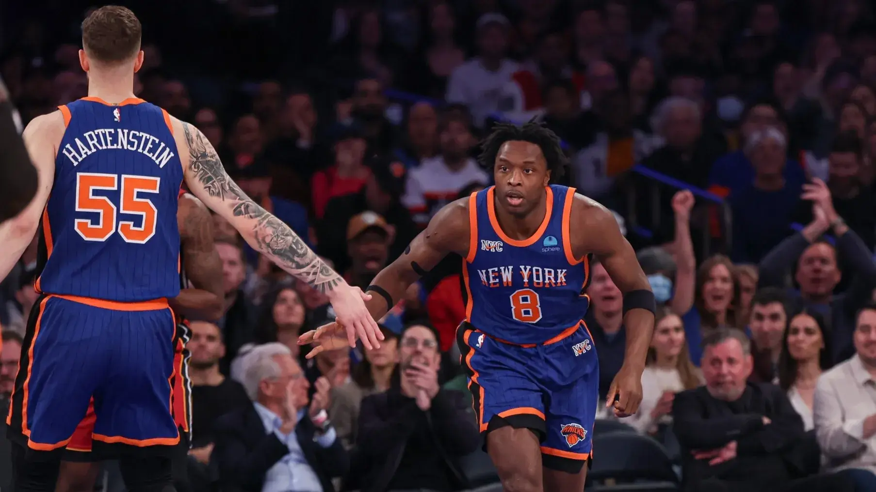 New York Knicks forward OG Anunoby (8) slaps hands with center Isaiah Hartenstein (55) after a basket against the Miami Heat during the first half at Madison Square Garden / Vincent Carchietta - USA TODAY Sports