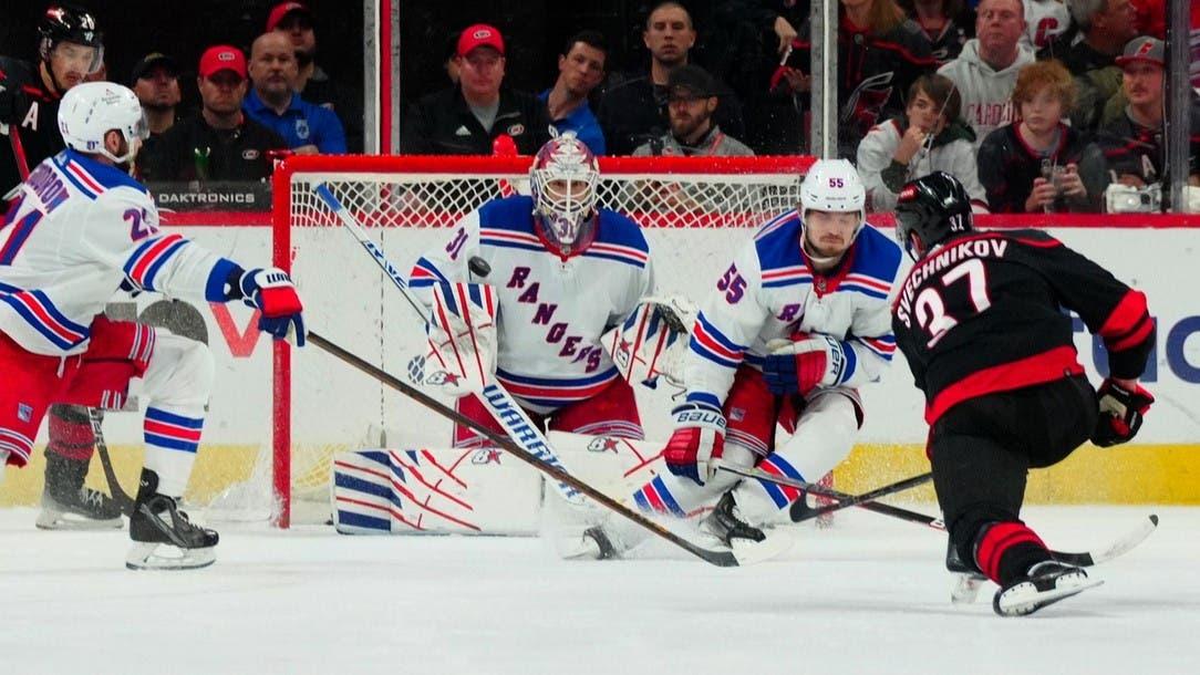 May 11, 2024; Raleigh, North Carolina, USA; Carolina Hurricanes right wing Andrei Svechnikov (37) shoots the puck against New York Rangers defenseman Ryan Lindgren (55) and goaltender Igor Shesterkin (31) during the second period in game four of the second round of the 2024 Stanley Cup Playoffs at PNC Arena. / James Guillory-USA TODAY Sports