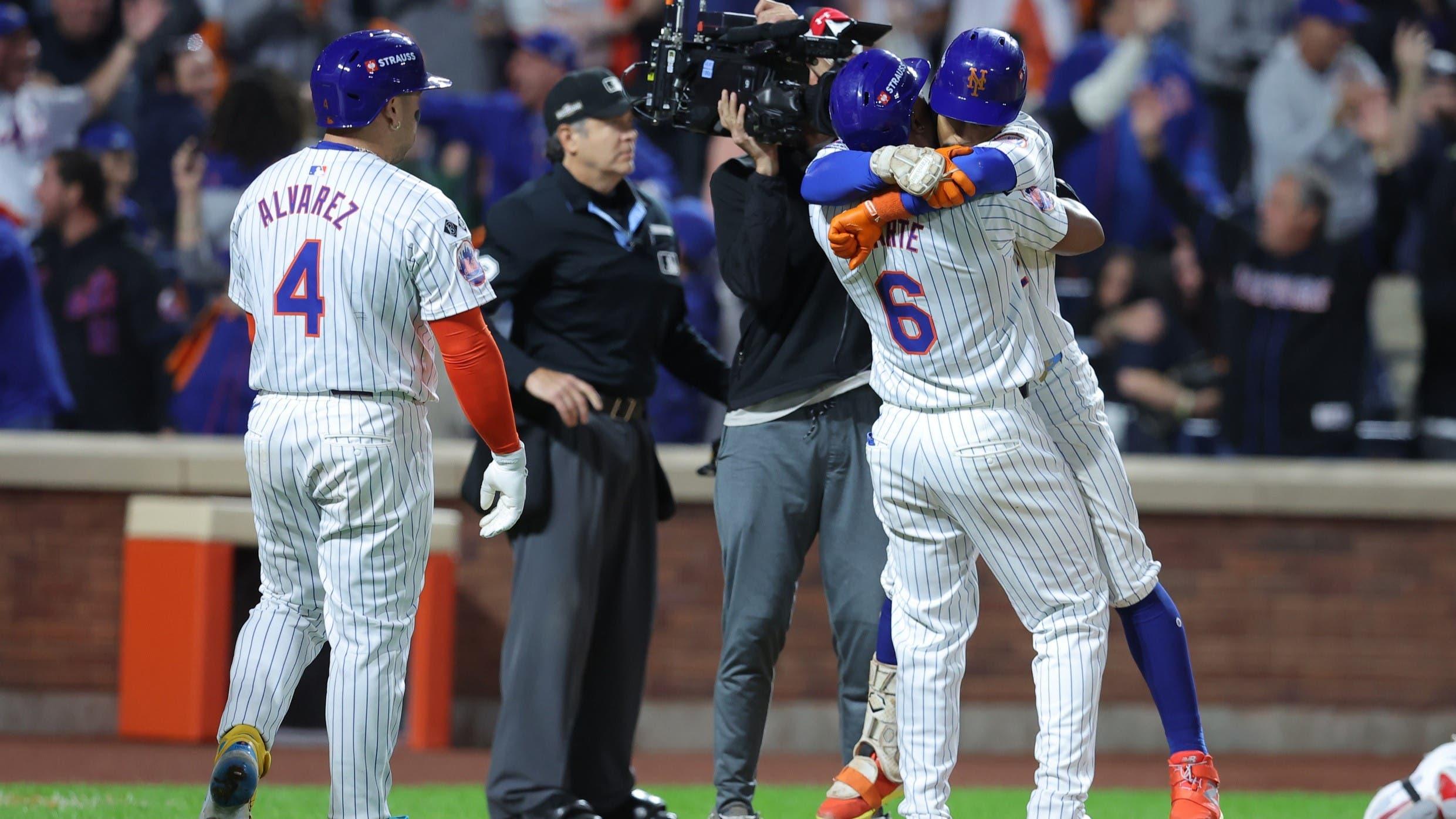 Oct 9, 2024; New York, New York, USA; New York Mets shortstop Francisco Lindor (12) celebrates with Mets outfielder Starling Marte (6) after hitting a grand slam against the Philadelphia Phillies in the sixth inning in game four of the NLDS for the 2024 MLB Playoffs at Citi Field. / Brad Penner-Imagn Images