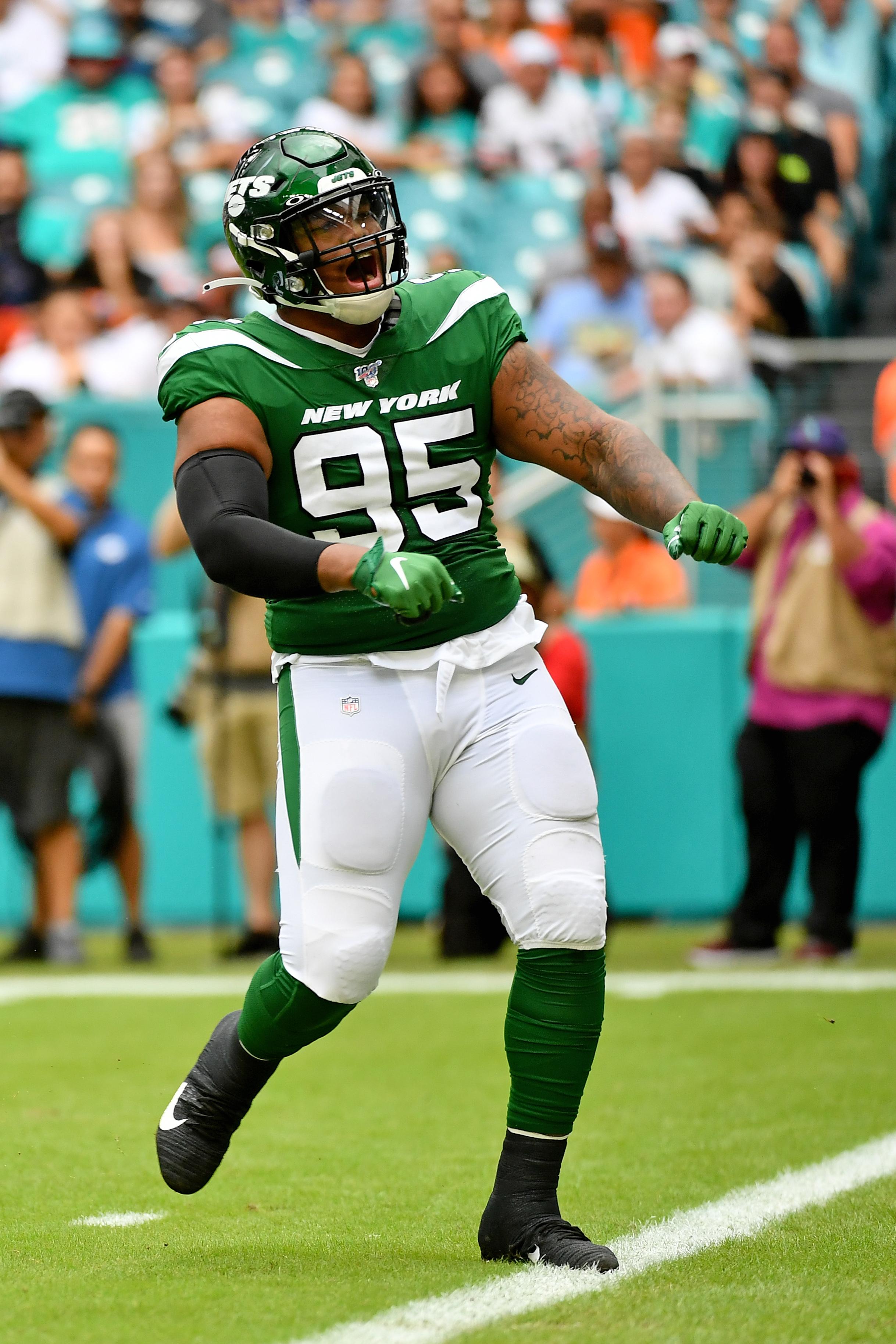 Nov 3, 2019; Miami Gardens, FL, USA; New York Jets defensive tackle Quinnen Williams (95) reacts after sacking Miami Dolphins quarterback Ryan Fitzpatrick (14) during the first half at Hard Rock Stadium. Mandatory Credit: Jasen Vinlove-USA TODAY Sports