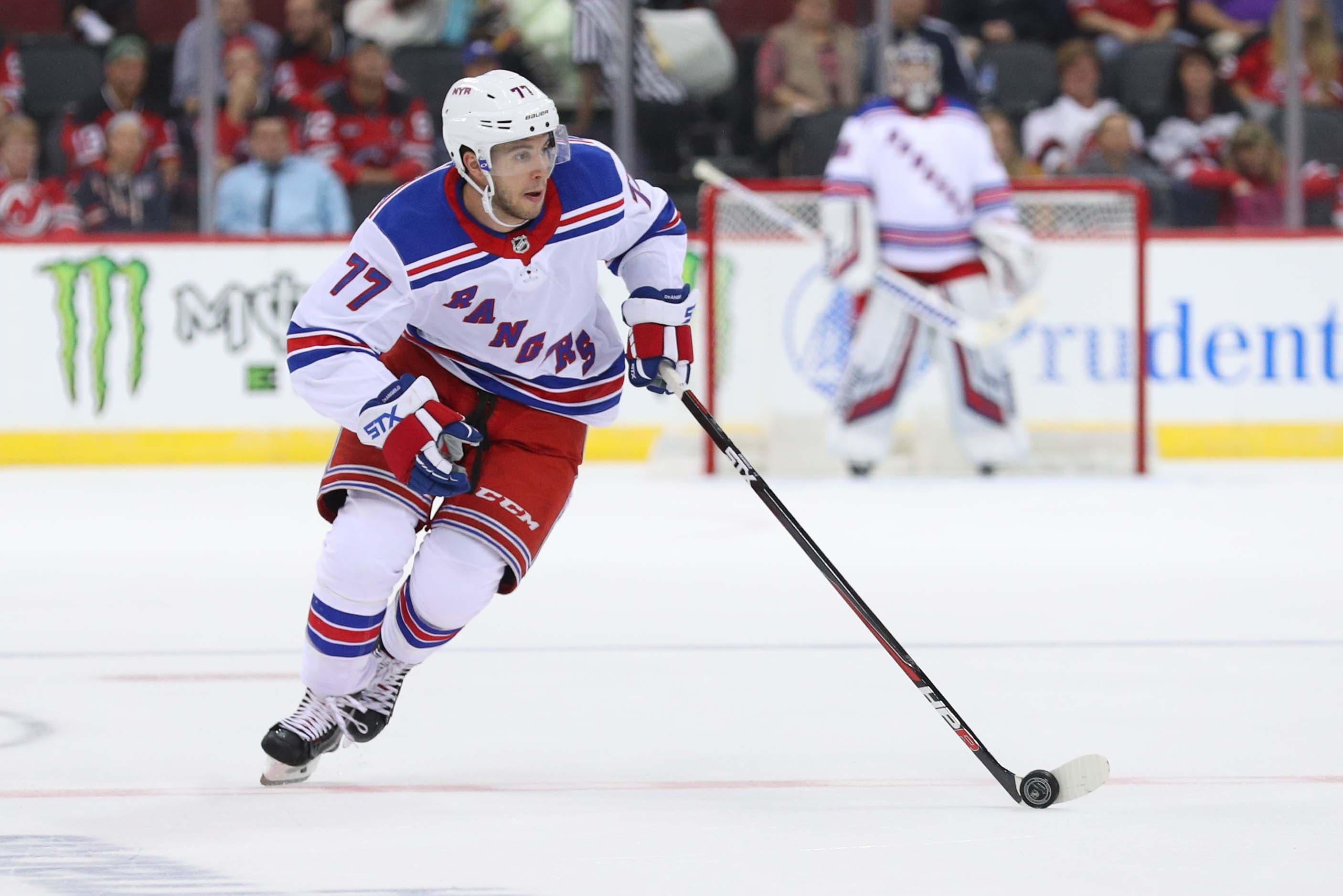 Sep 17, 2018; Newark, NJ, USA; New York Rangers defenseman Tony DeAngelo (77) skates with the puck during the first period of their game against the New Jersey Devils at Prudential Center. Mandatory Credit: Ed Mulholland-USA TODAY Sports / Ed Mulholland