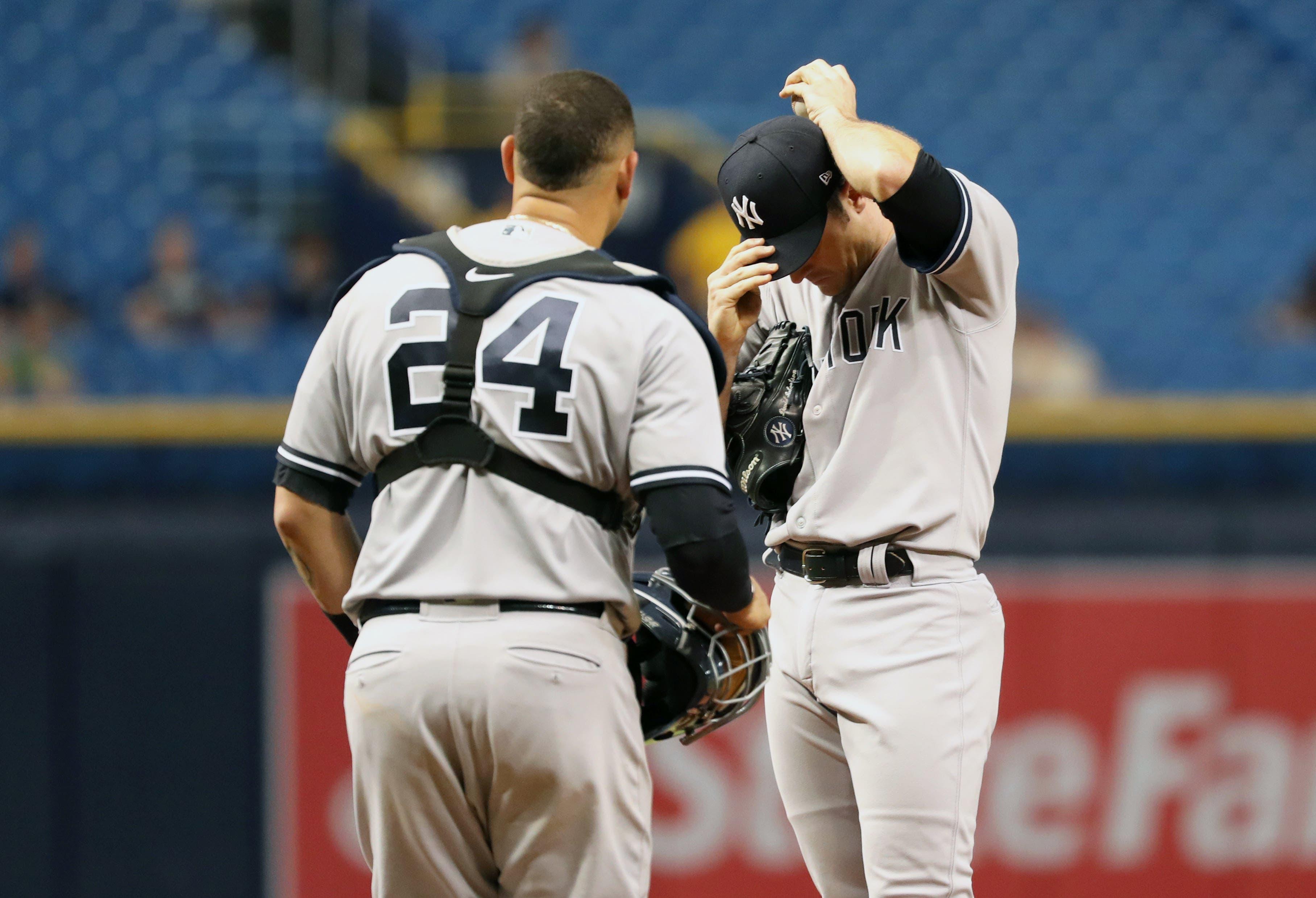 Sep 26, 2018; St. Petersburg, FL, USA; New York Yankees relief pitcher David Robertson (30) reacts as catcher Gary Sanchez (24) comes to the mound to talk during the eighth inning against the Tampa Bay Rays at Tropicana Field. Mandatory Credit: Kim Klement-USA TODAY Sports / Kim Klement