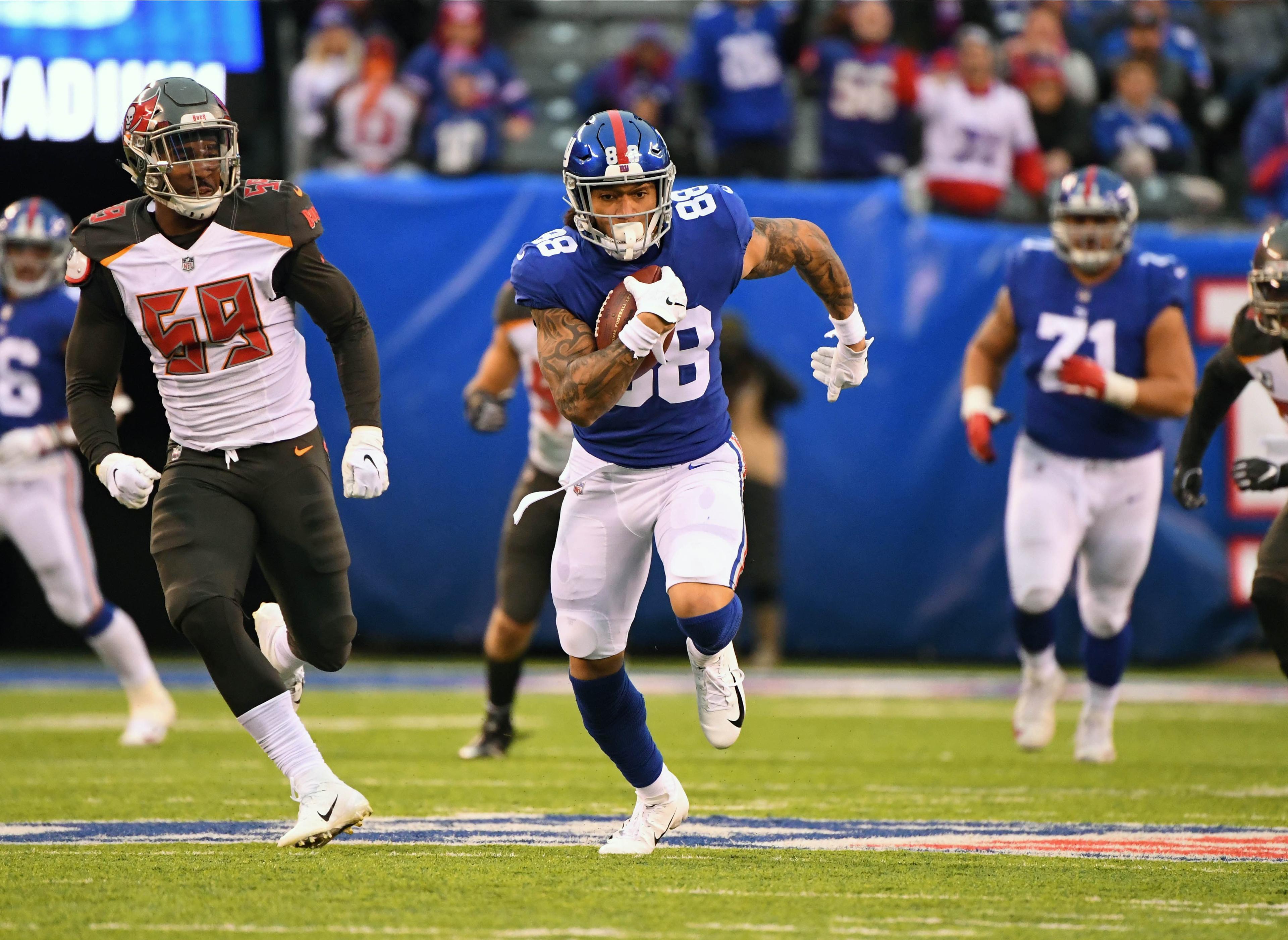 Nov 18, 2018; East Rutherford, NJ, USA; 
New York Giants tight end Evan Engram (88) with a long 4th quarter 1st down against the Tampa Bay Buccaneers at MetLife Stadium. Mandatory Credit: Robert Deutsch-USA TODAY Sports / Robert Deutsch