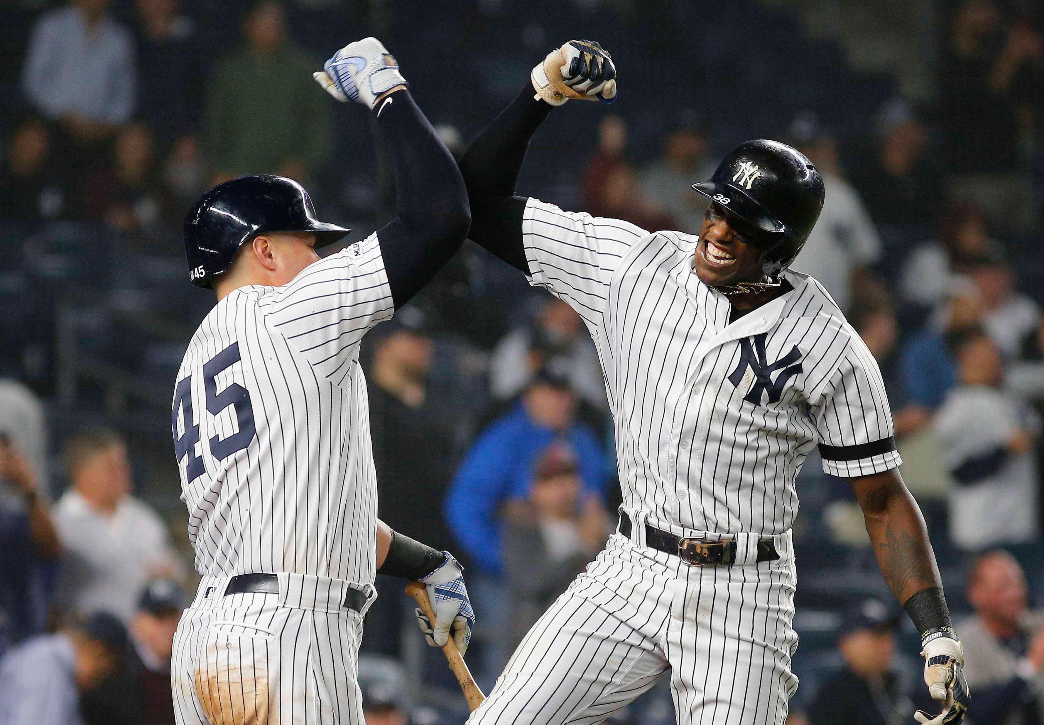 Jun 18, 2019; Bronx, NY, USA; New York Yankees left fielder Cameron Maybin (38) is congratulated by New York Yankees first baseman Luke Voit (45) after hitting a solo home run against the Tampa Bay Rays during the seventh inning at Yankee Stadium. Mandatory Credit: Andy Marlin-USA TODAY Sports / Andy Marlin