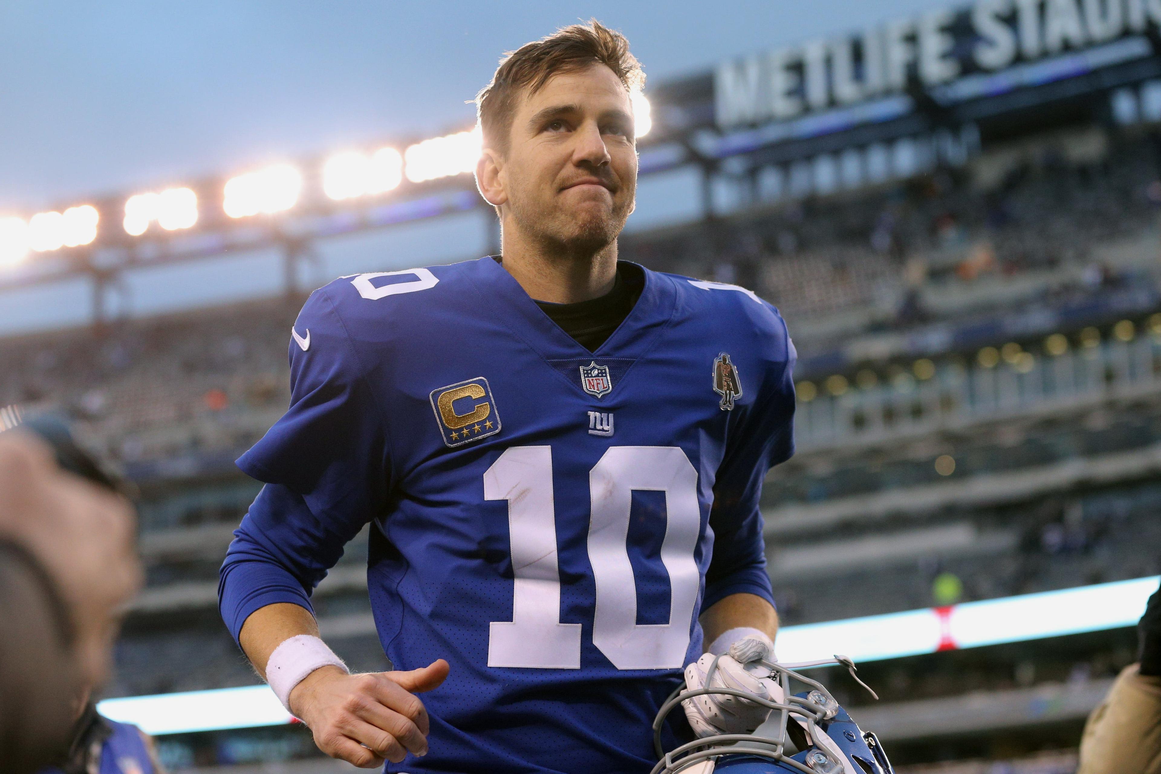 Dec 30, 2018; East Rutherford, NJ, USA; New York Giants quarterback Eli Manning (10) leaves the field after losing to the Dallas Cowboys at MetLife Stadium. Mandatory Credit: Brad Penner-USA TODAY Sports / Brad Penner