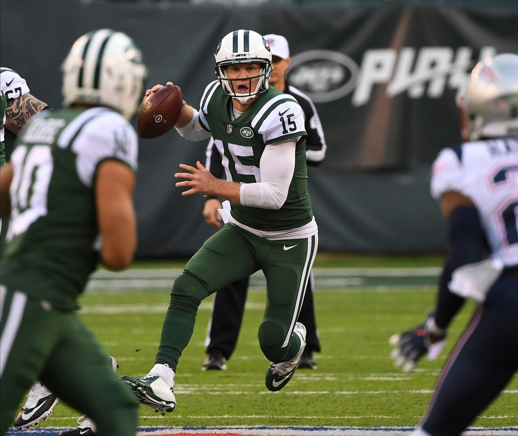 New York Jets quarterback Josh McCown looks for a receiver during the third quarter against the New England Patriots at MetLife Stadium.